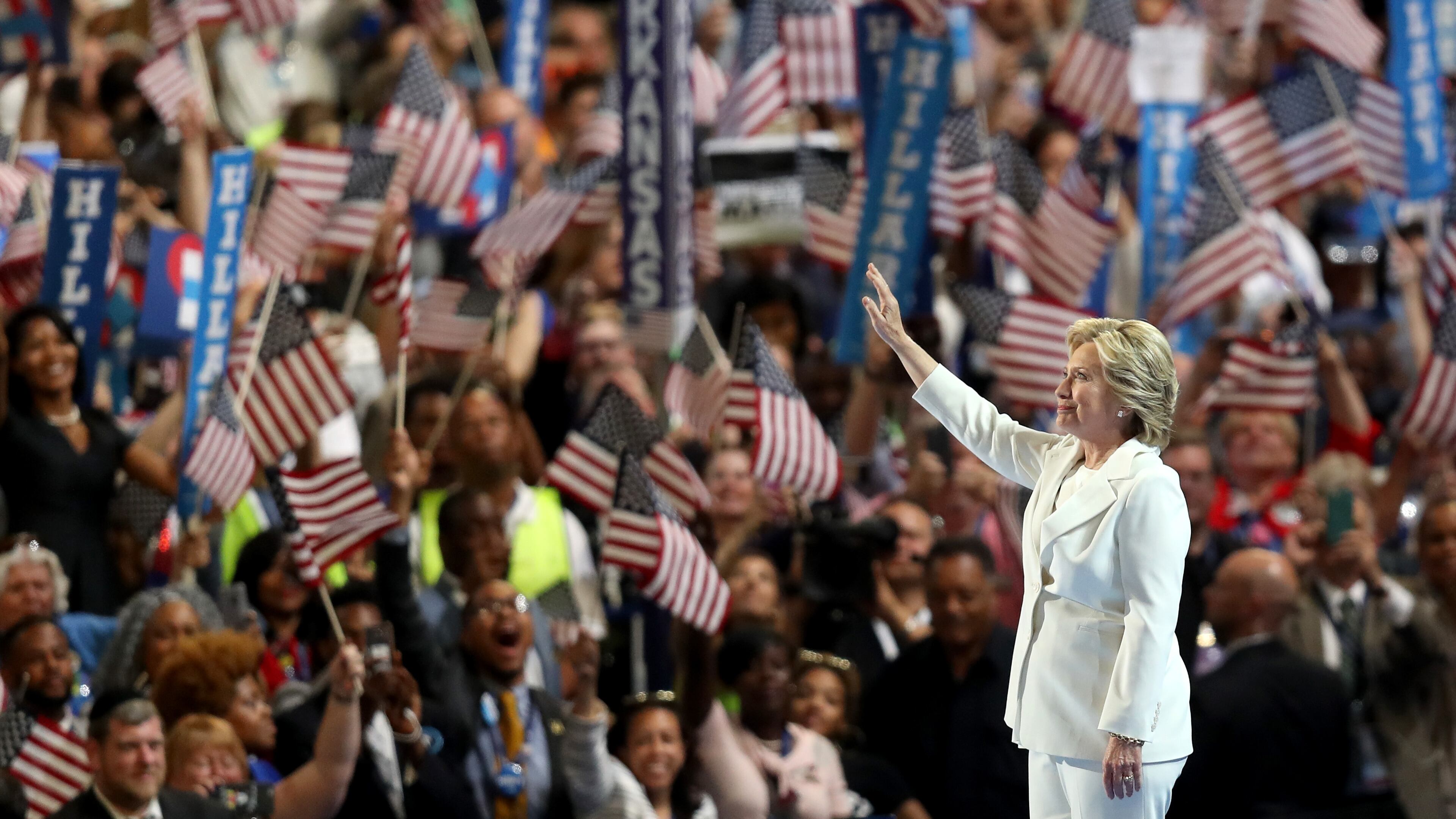 PHILADELPHIA, PA - JULY 28: Democratic presidential candidate Hillary Clinton acknowledges the crowd as she arrives on stage during the fourth day of the Democratic National Convention at the Wells Fargo Center, July 28, 2016 in Philadelphia, Pennsylvania. Democratic presidential candidate Hillary Clinton received the number of votes needed to secure the party's nomination. An estimated 50,000 people are expected in Philadelphia, including hundreds of protesters and members of the media. The four-day Democratic National Convention kicked off July 25. (Photo by Joe Raedle/Getty Images)