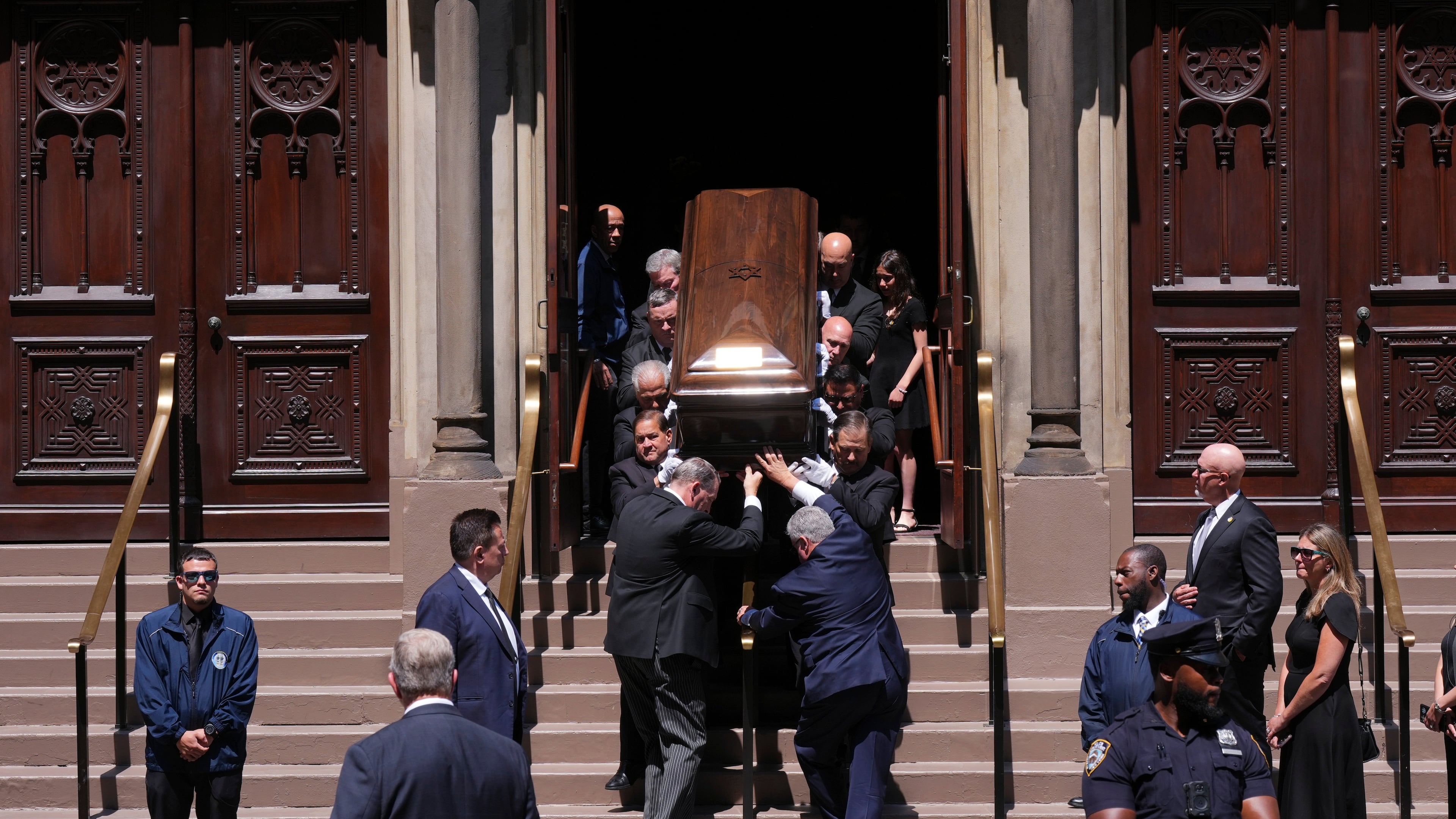 Pallbearers carry the casket after funeral services for Clive Davis at Central Synagogue in New York, Monday, June 29, 2026. (AP Photo/Adam Gray)