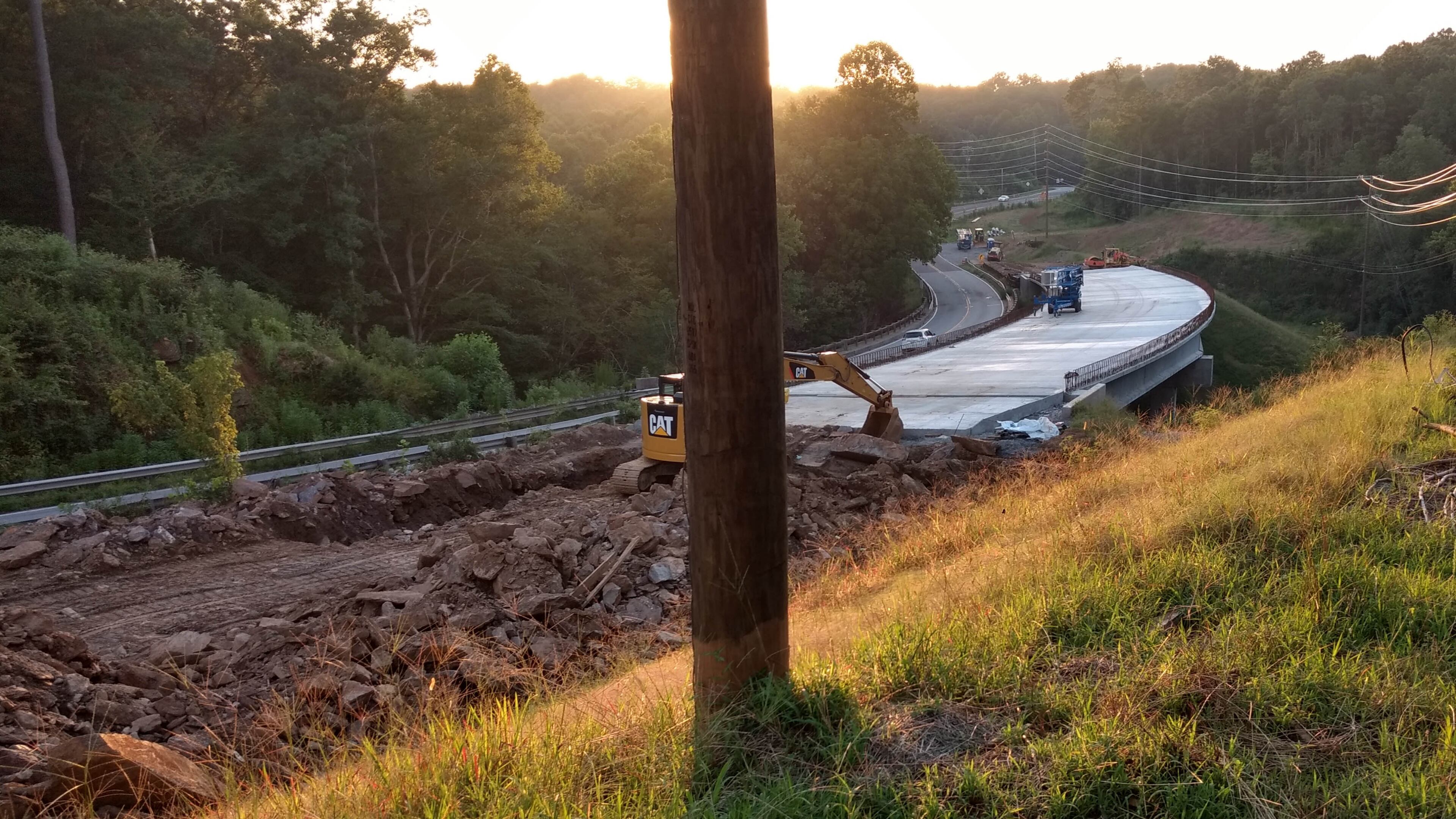 Georgia DOT crews are building a replacement bridge on Arnold Mill Road at the Fulton-Cherokee County line. Arnold Mill Road / Ga. 140 will be moved just to the north to connect to the new bridge high above Little River. Photo taken Aug. 5, 2018. (Brian O'Shea / bposhea@ajc.com)