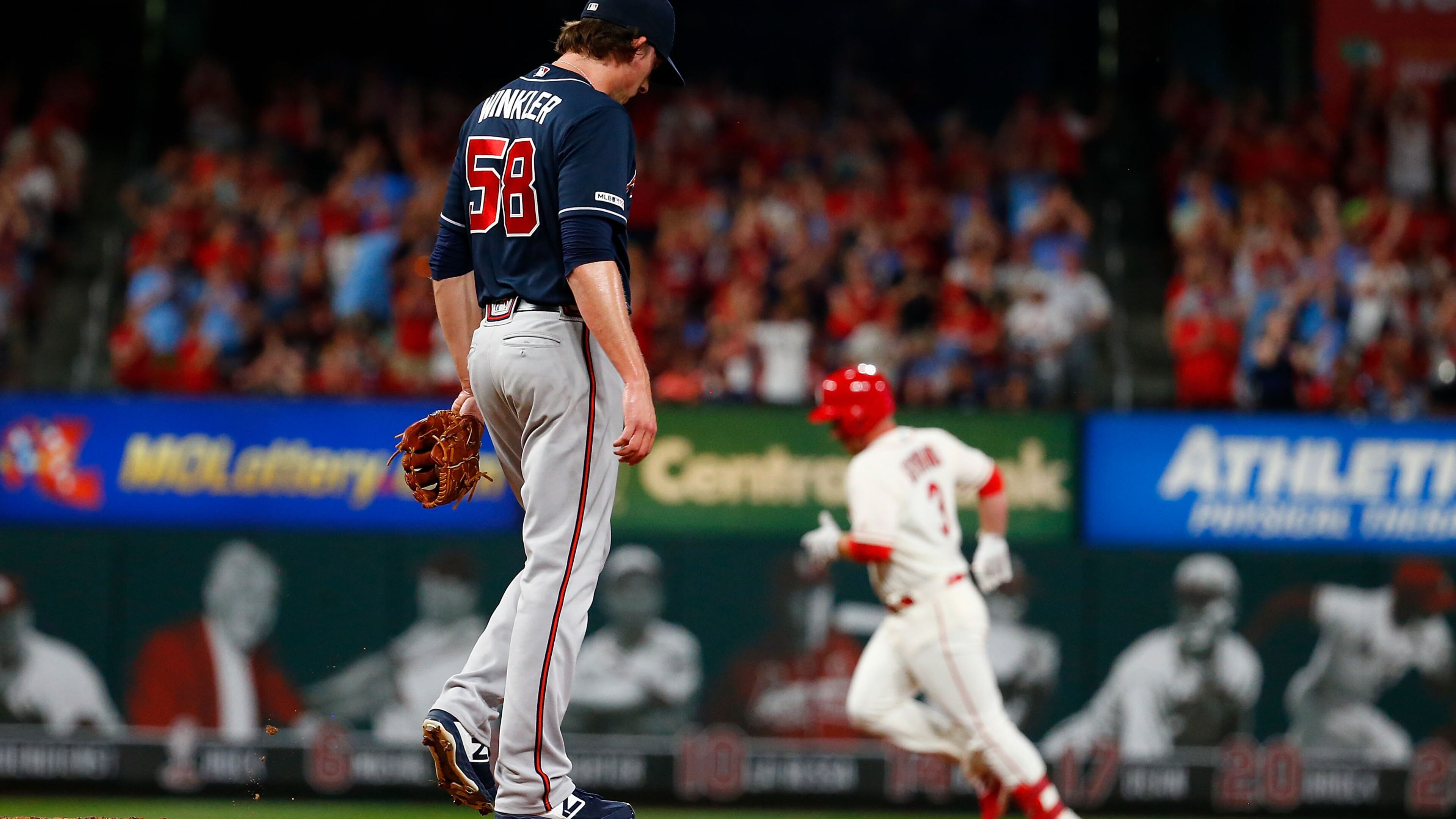 Braves relief pitcher Dan Winkler reacts after the Cardinals’ Jedd Gyorko hit a game-winning three-run home run against in the eighth inning at Busch Stadium on Saturday night.