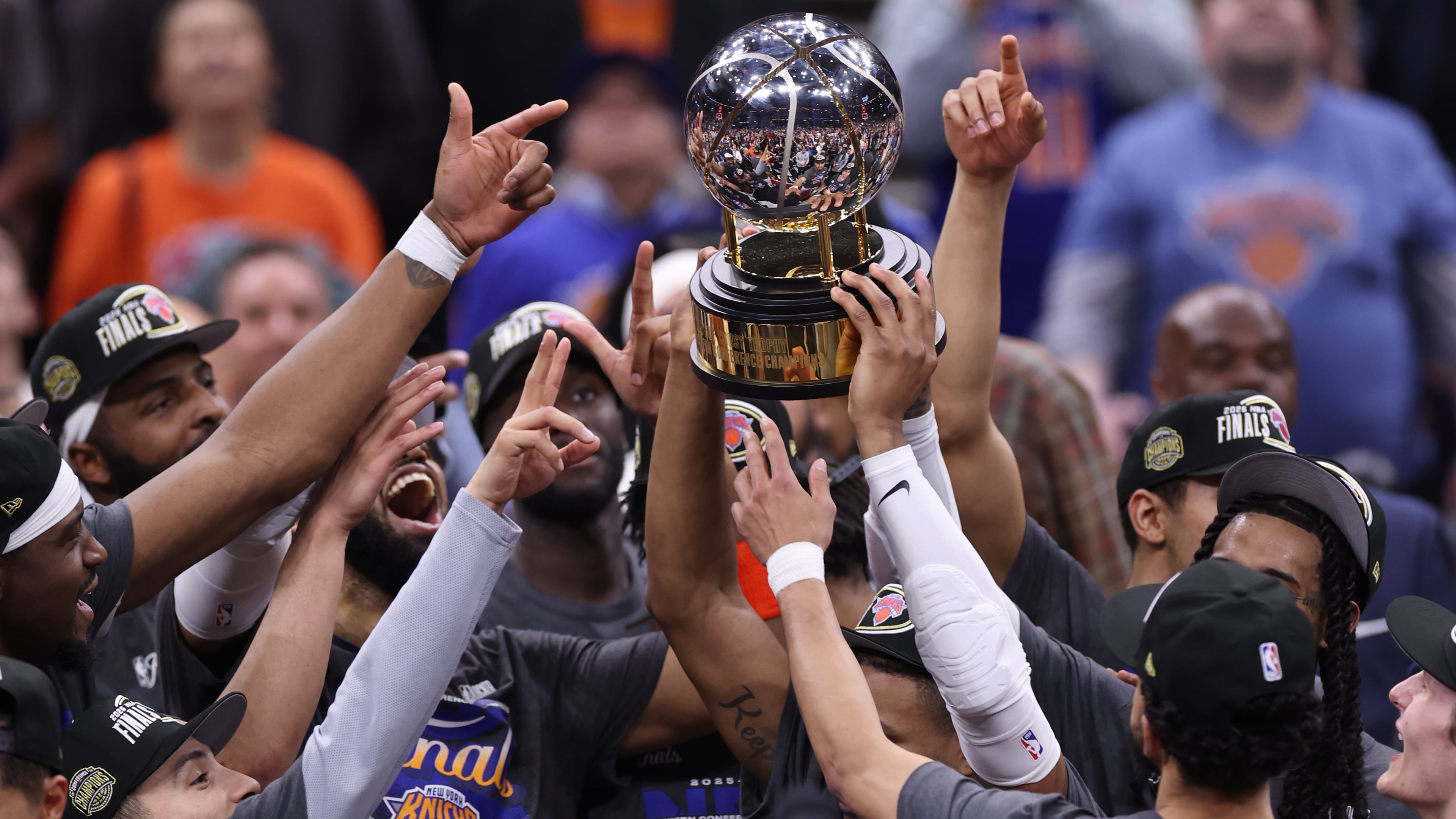 The New York Knicks hold the Eastern Conference Championship trophy after Game 4 in the Eastern Conference finals NBA basketball playoffs series against the Cleveland Cavaliers in Cleveland, Monday, May 25, 2026. (AP Photo/Tim Phillis)