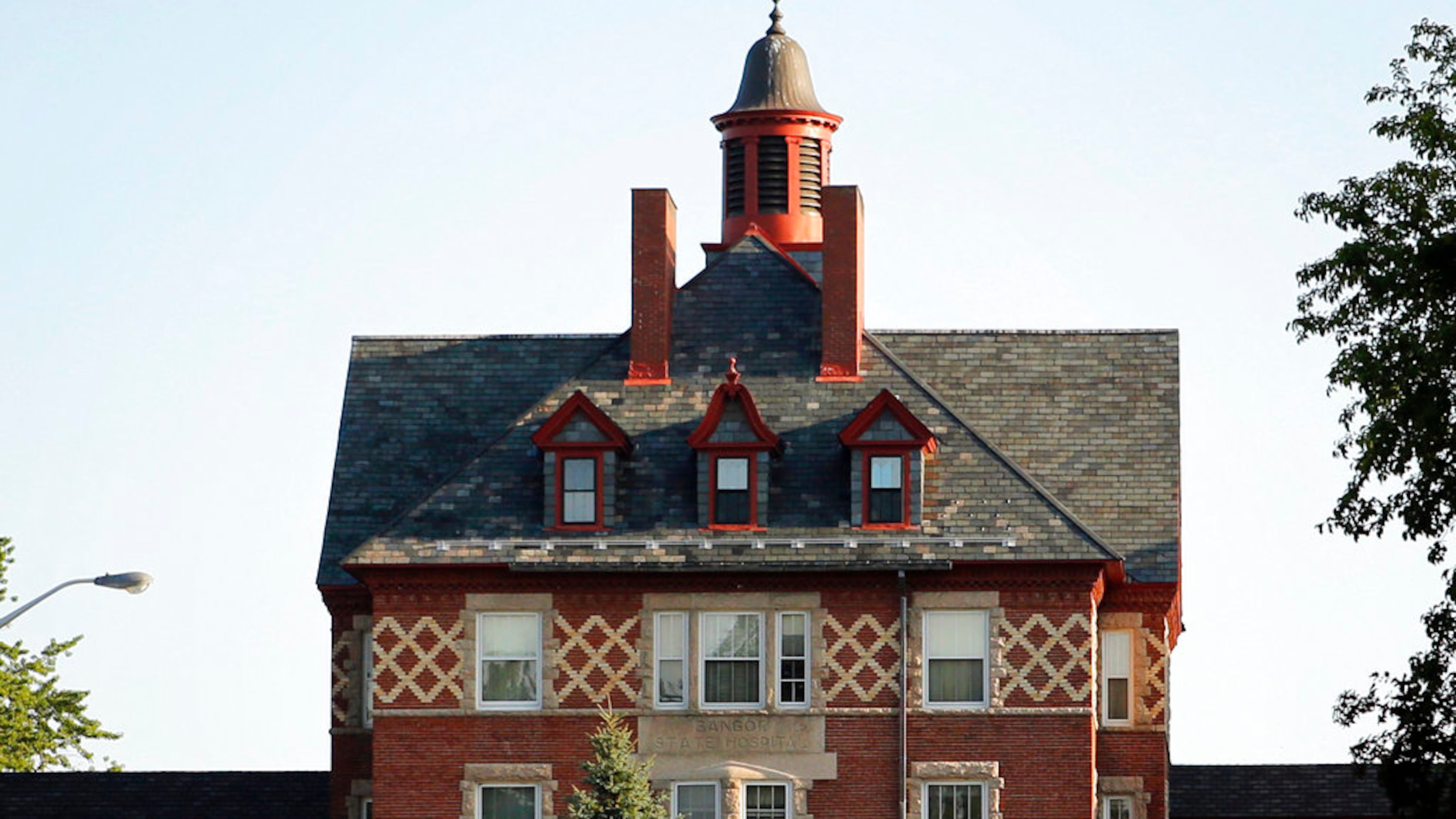 FILE - This July 30, 2018 file photo shows the Dorothea Dix Psychiatric Center, formerly known as Bangor Mental Health Institute in Bangor, Maine. A Florida-based health care company that could receive a $60.3 million state contract to run a 21-bed Maine residence for some psychiatric patients is fighting to keep its proposal secret. (AP Photo/Robert F. Bukaty, File)