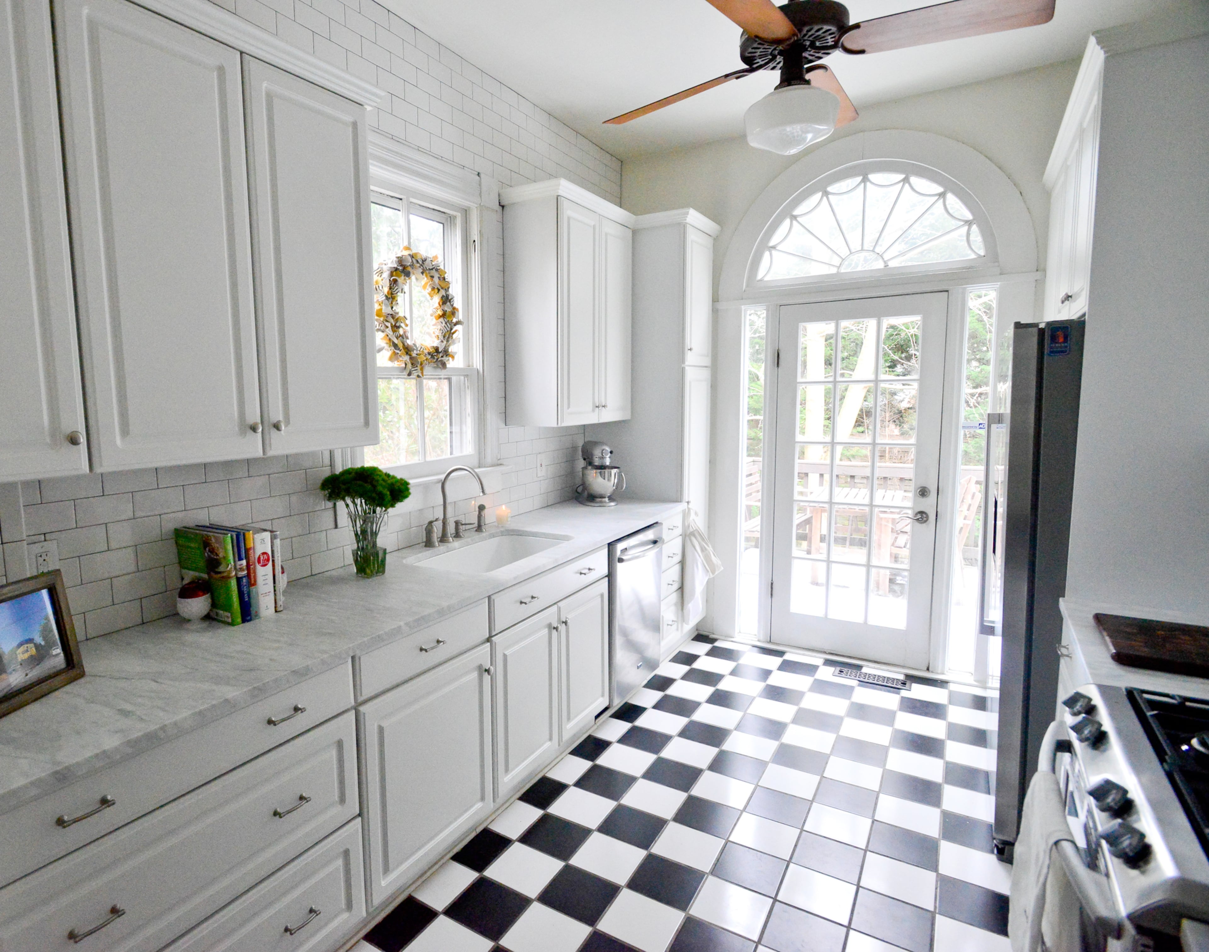 Kendall and Nick Stowell have spent $8,000 to renovate the kitchen of their Inman Park home, but kept the black and white ceramic tile floor. The countertops are Avenza marble and subway tile goes from the floor to the ceiling. The appliances are Maytag, except the refrigerator, which was bought from IKEA.