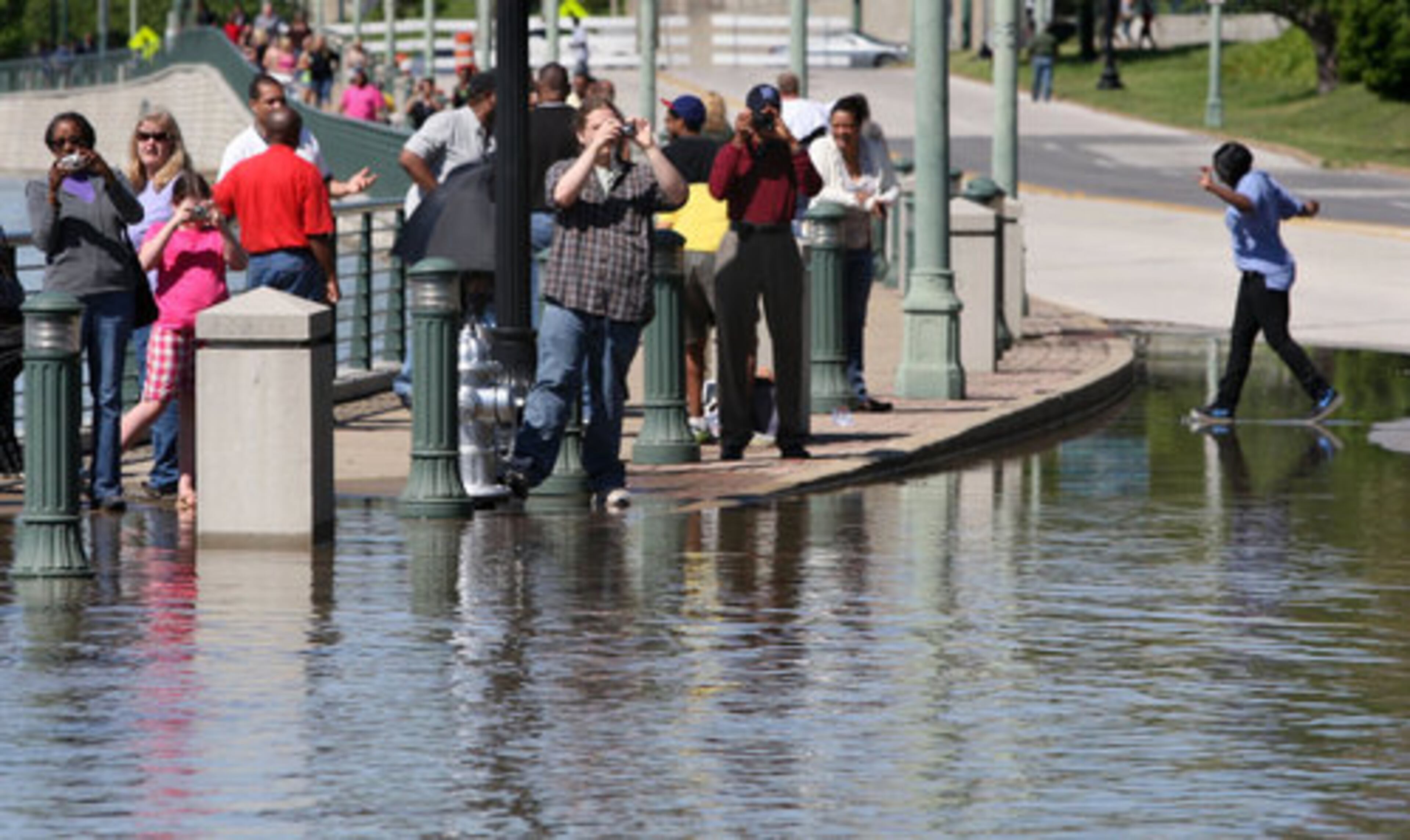 People gather downtown to watch the Mississippi River at Beale Street and Riverside Drive, Friday, May 6, 2011 in Memphis, Tenn.