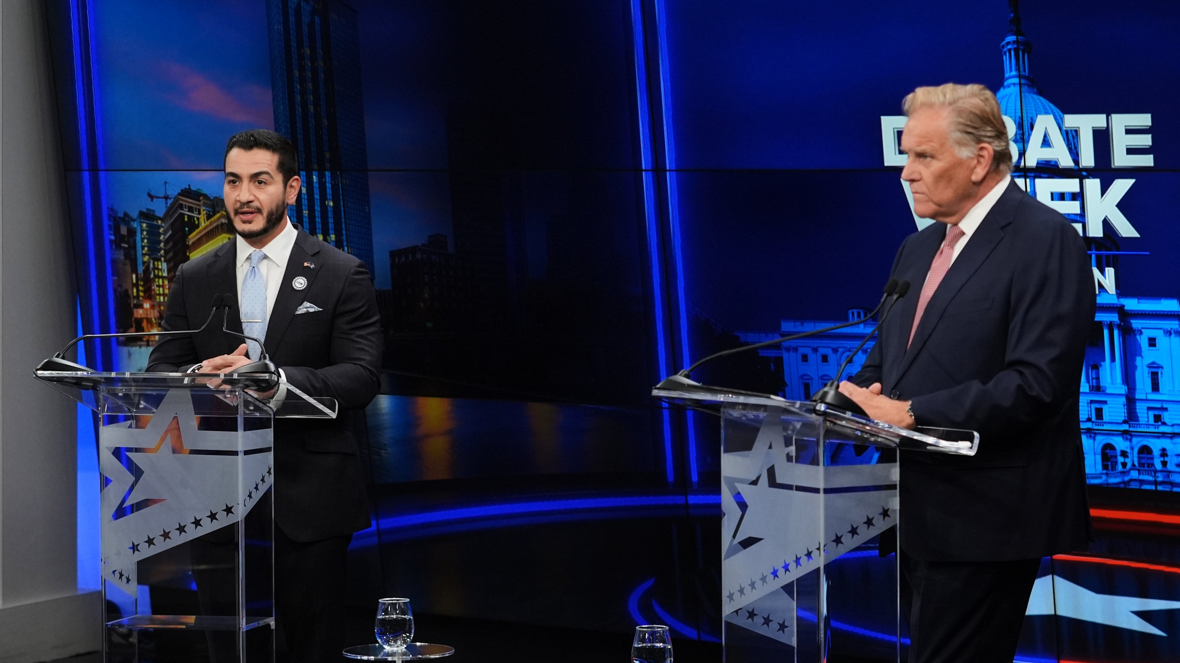 Republican nominee for U.S. Senate Mike Rogers, right, faces off against Democratic nominee for U.S. Senate Abdul El-Sayed, during a televised debate at WOOD-TV, on Thursday, Oct. 8, 2026, in Grand Rapids, Mich. (AP Photo/Paul Sancya, Pool)