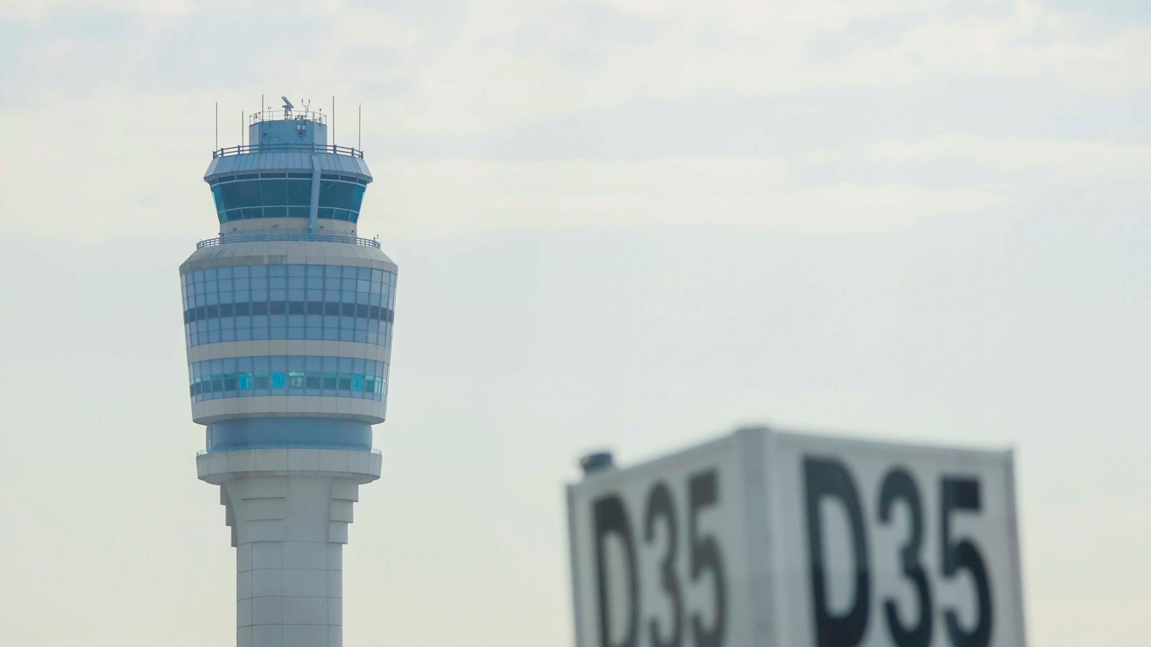 The control tower is seen on the runway at the Hartsfield-Jackson Atlanta International Airport on Wednesday, Sept. 17, 2025. (Miguel Martinez/ AJC)