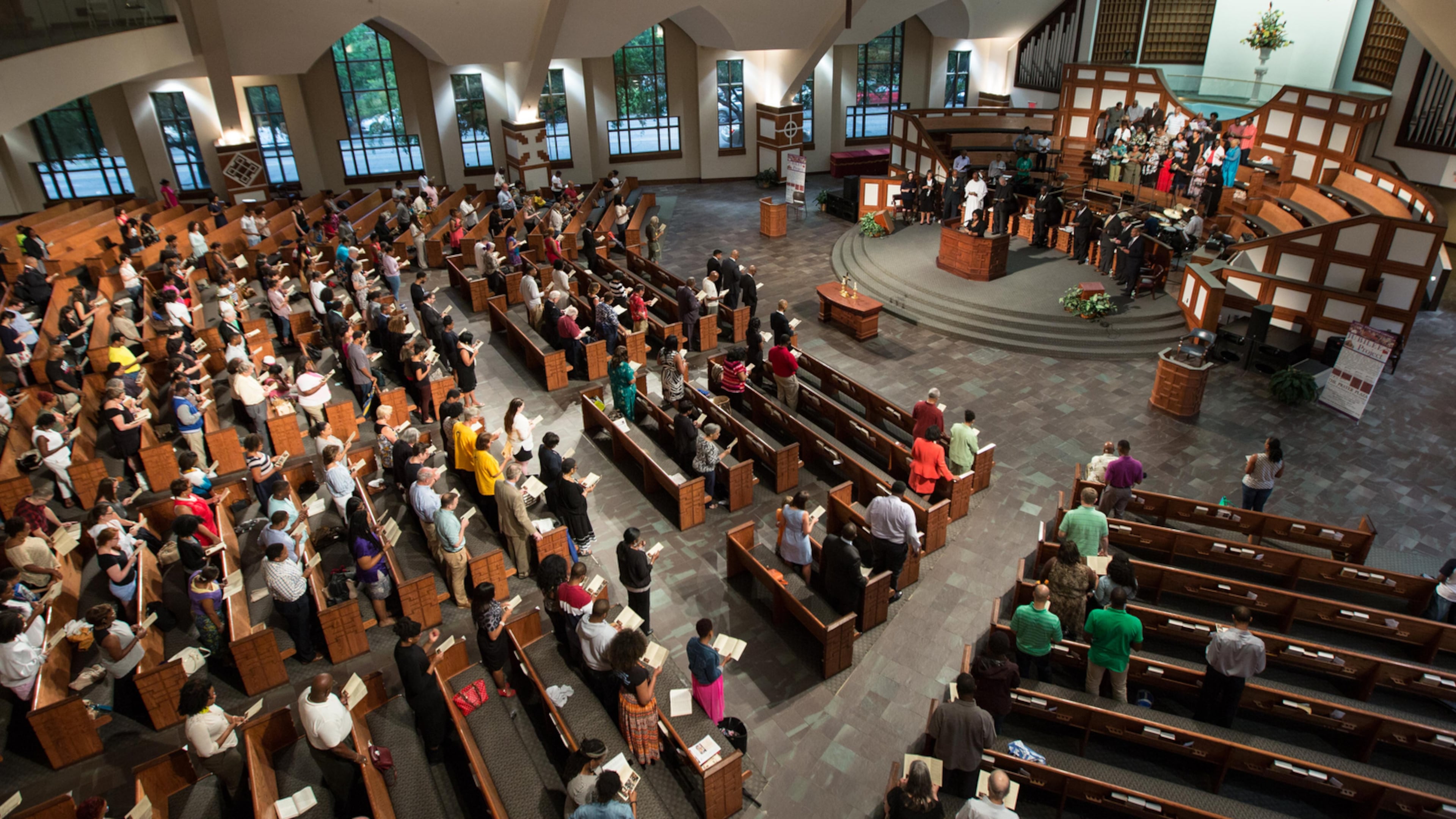 EBENEZER VIGIL--People stand during a prayer service at Ebenezer Baptist Church for the nine people who were killed at the historic Emanuel AME Church in Charleston, S.C., Thursday, June 18, 2015, in Atlanta. BRANDEN CAMP/SPECIAL
