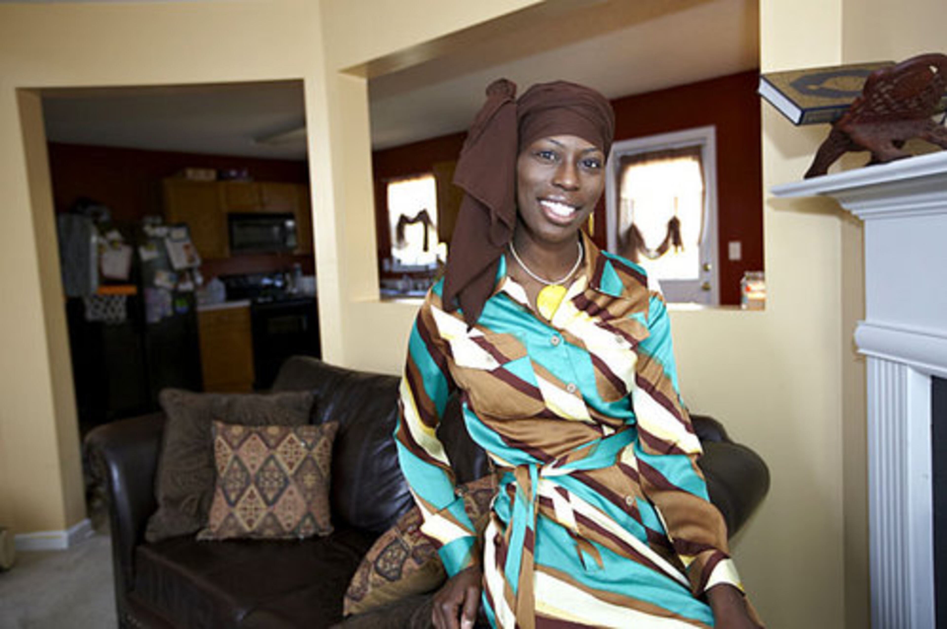 A weakness: "I absolutely love shopping for jewelry and scarves." El-Amin-Foster wears a silk Shakara shirt dress with jewelry from A Unique Touch boutique in Atlanta.