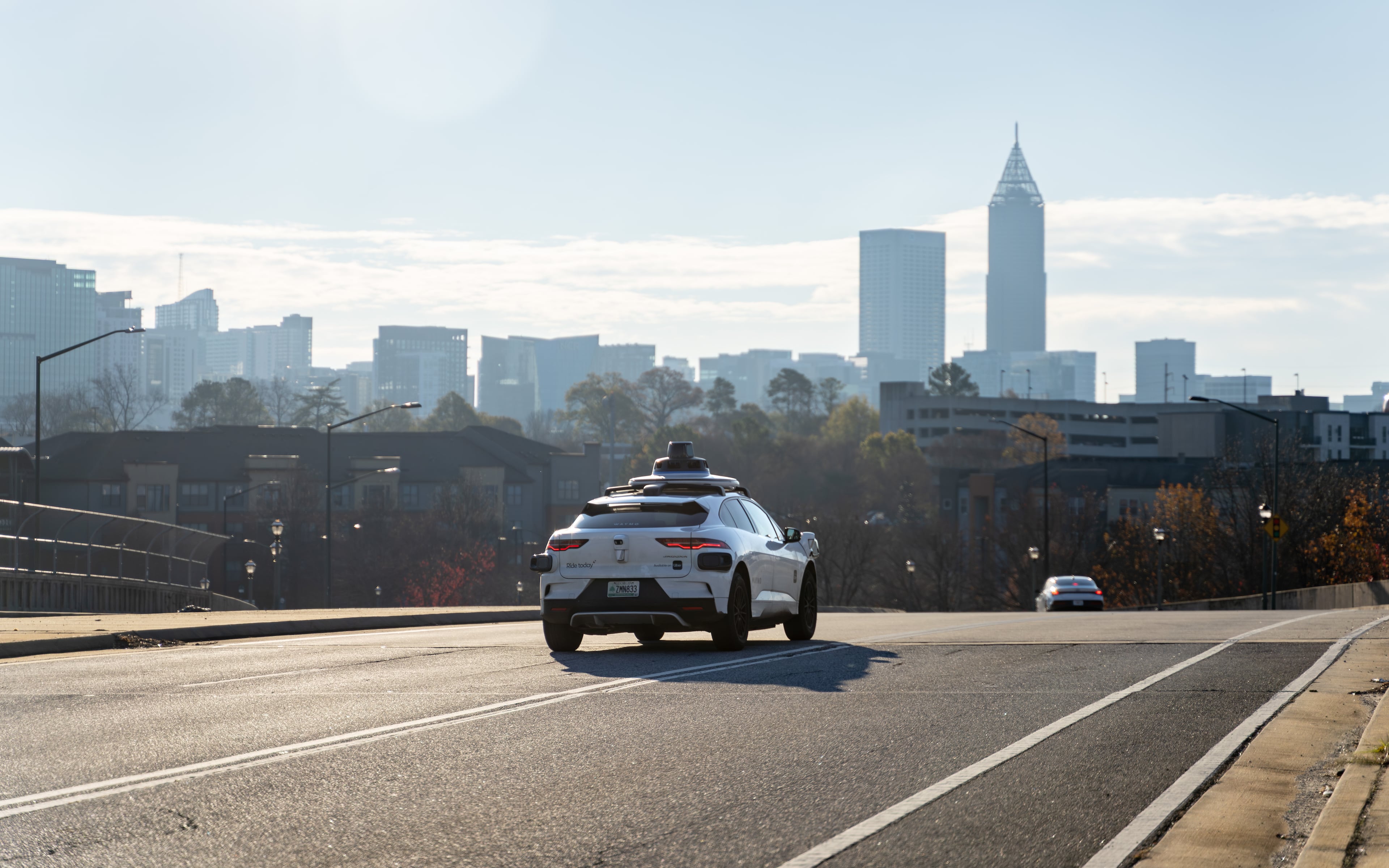 A Waymo self driving taxi travels down 17th Street in Atlanta, Georgia. Thursday, December 11, 2025 (Ben Hendren for the AJC)