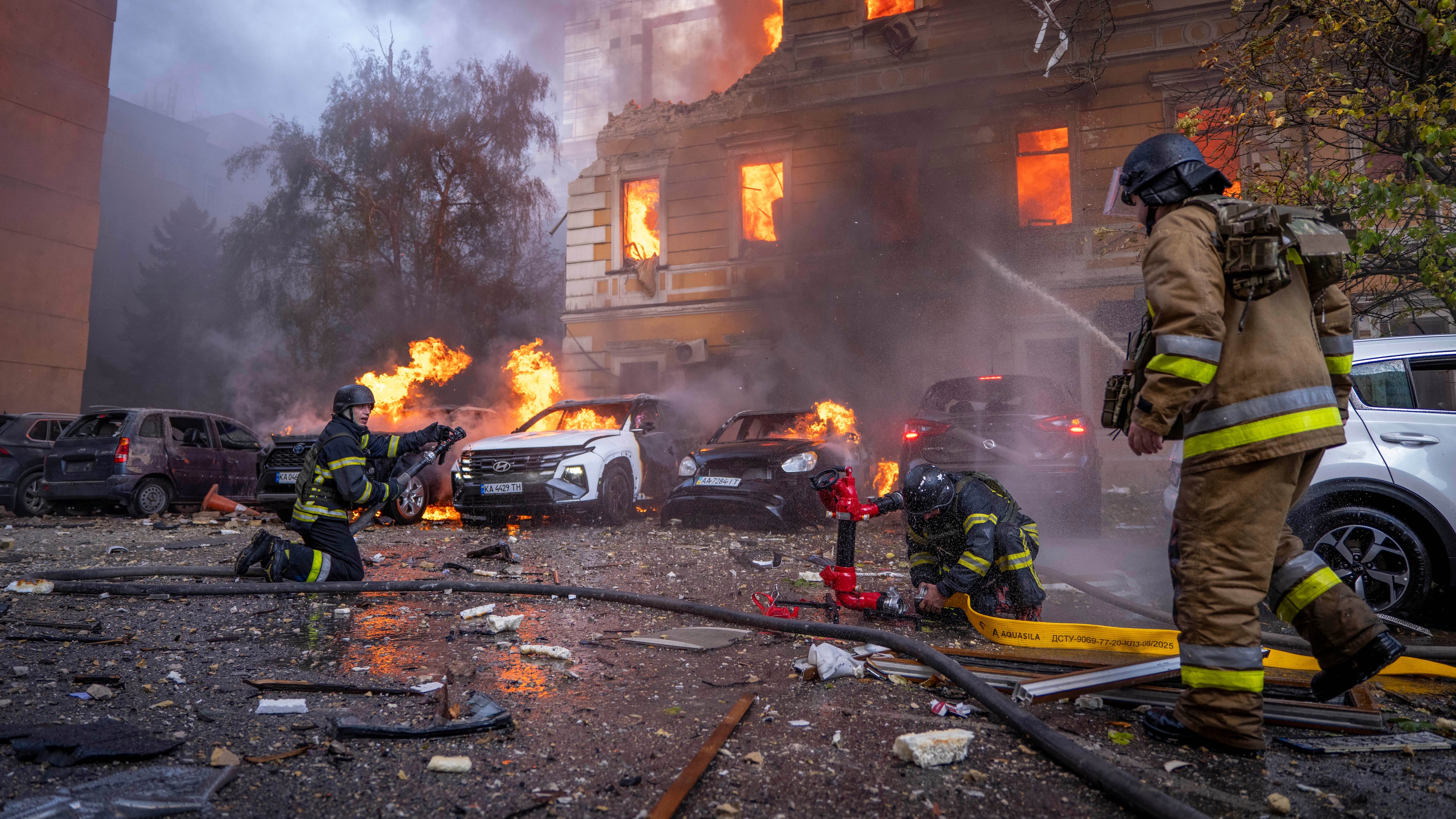 Rescue workers put out a fire at the National Academy of Sciences building damaged after a Russian drone strike in the center of Kyiv, Ukraine, Monday, Sept. 28, 2026. (AP Photo/Dan Bashakov)
