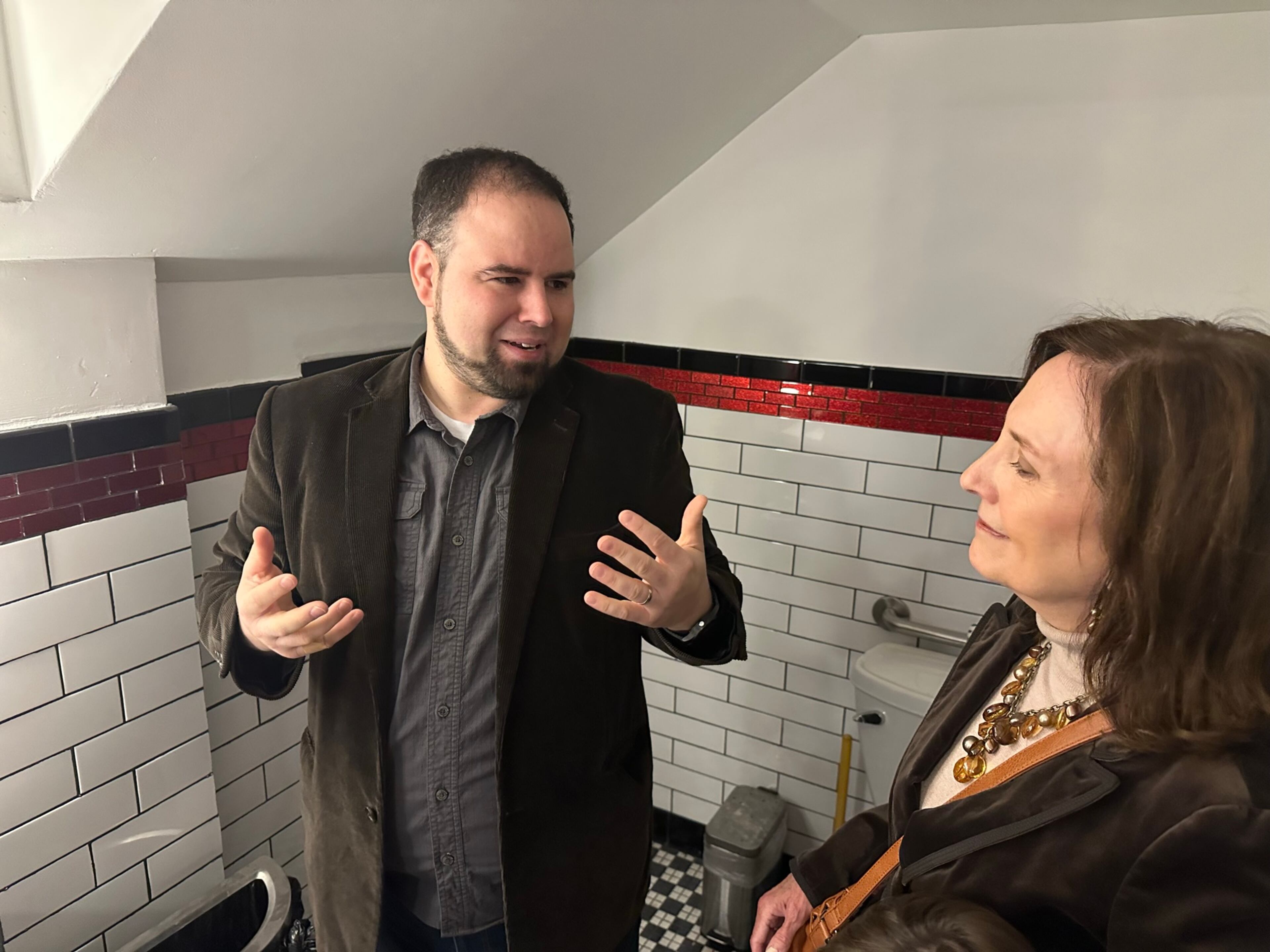 On Nov. 19, 2023, Christopher Escobar, owner of the Plaza Theatre, showing Thea Chamberlain where her mother's wallet was found in August, 2023. The wallet was left at the theater around September, 1958, 65 years earlier. RODNEY HO/rho@ajc.com