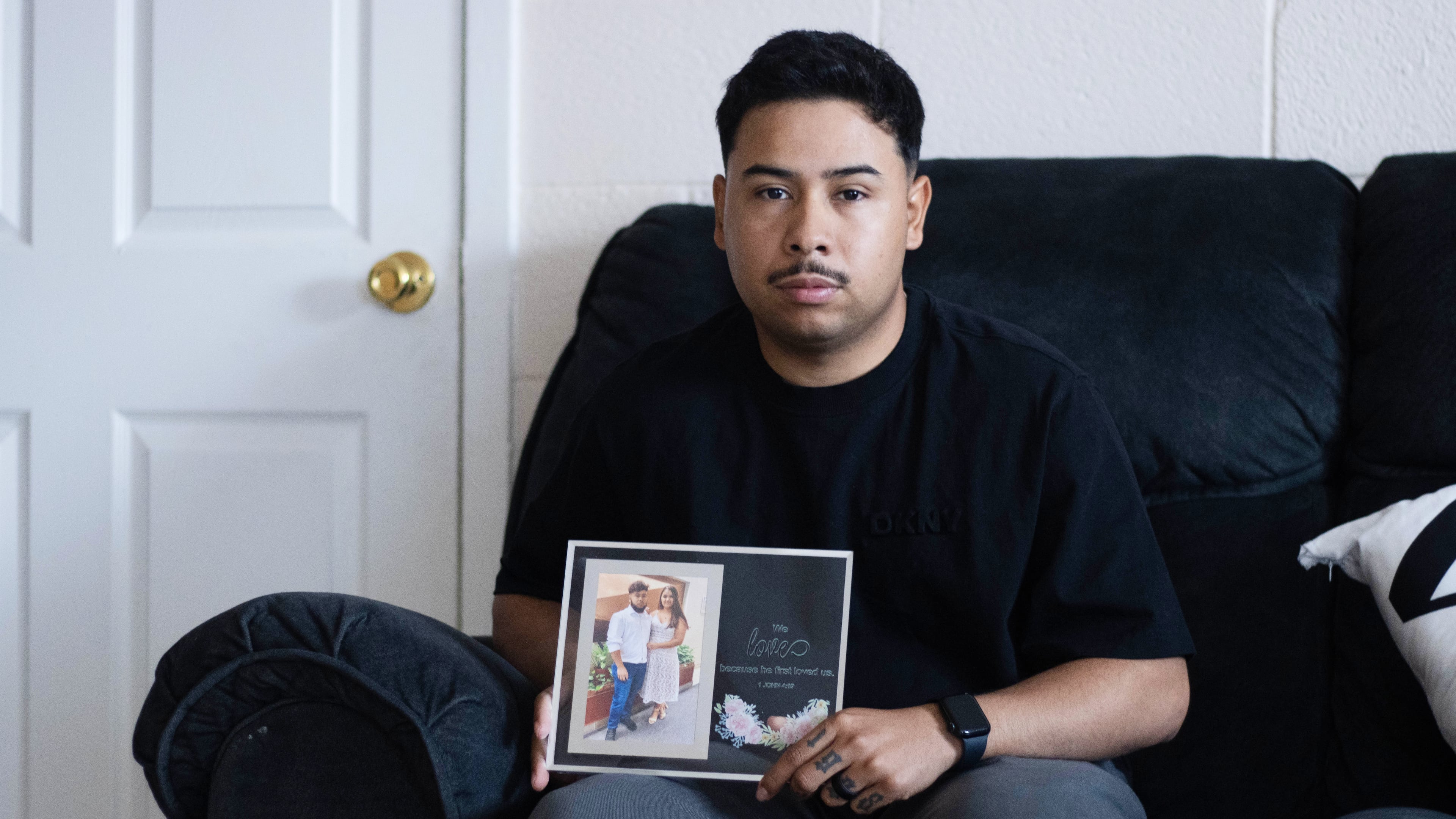 FILE - Army Sgt. Hedar Leonel Turcios Juarez holds a picture of himself with with his wife Cristy at home in El Paso, Texas, July 21, 2026. (AP Photo/Ryan Romero, File)