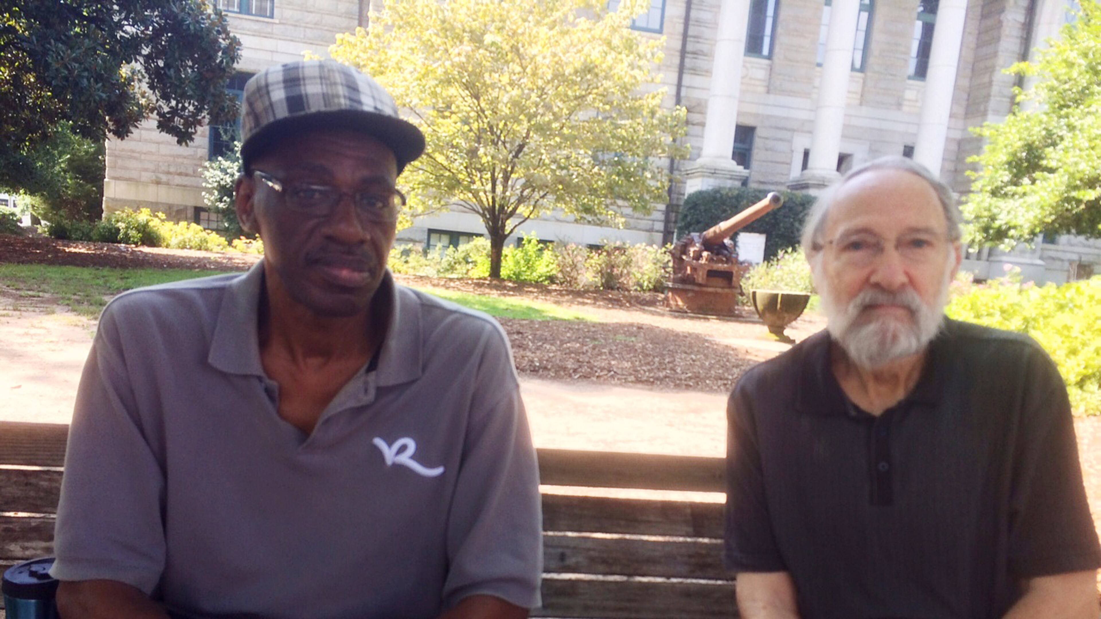 Melvin Brown (left) and Derek Miller were having a discussion on race just before Atlanta Journal-Constitution reporter Bill Torpy stumbled upon them in downtown Decatur. The city is weighing kicking off an expensive series of roundtable talks on the touchy subject. BILL TORPY BTORPY@AJC.COM