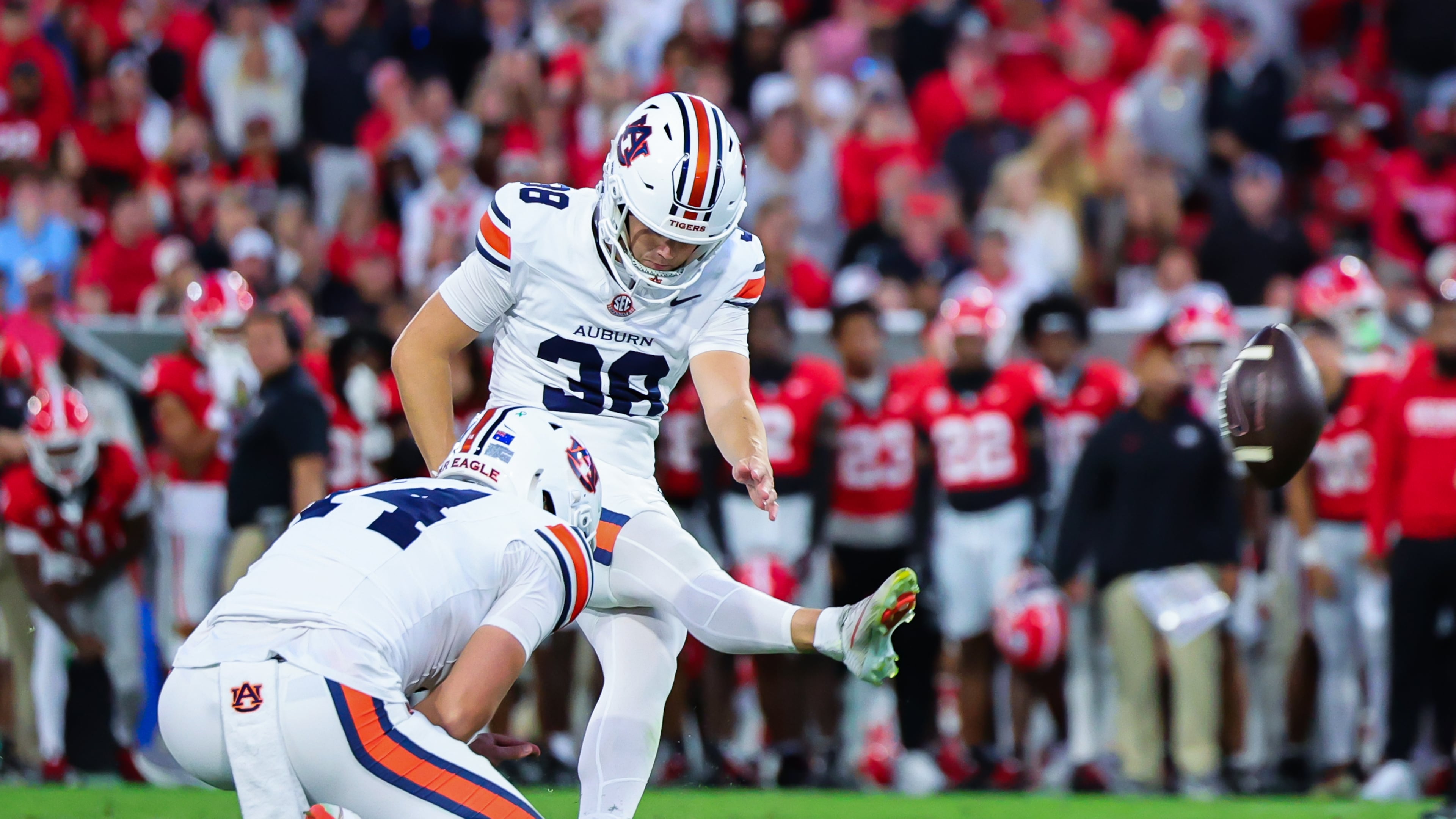 Auburn kicker Alex McPherson (38) kicks the game-winning field goal as time expired in the second half of an NCAA college football game against Georgia, Saturday, Oct. 17, 2026, in Athens, Ga. (AP Photo/Colin Hubbard)
