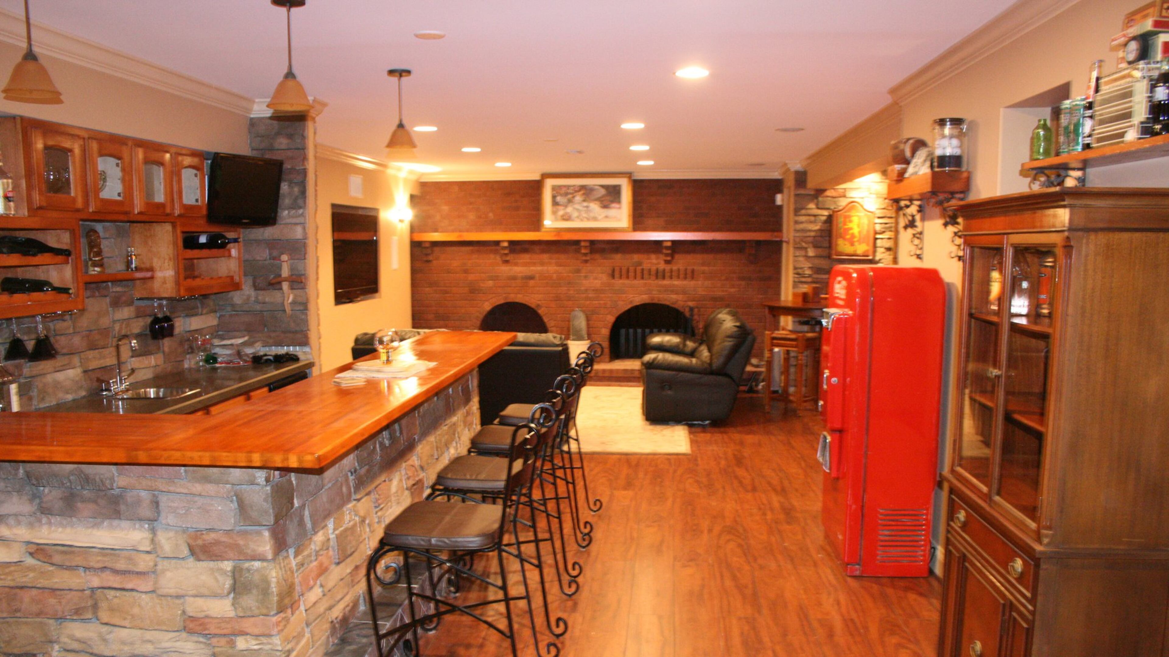 A lower level bar and game table creates a warm and inviting space. (Handout/TNS)