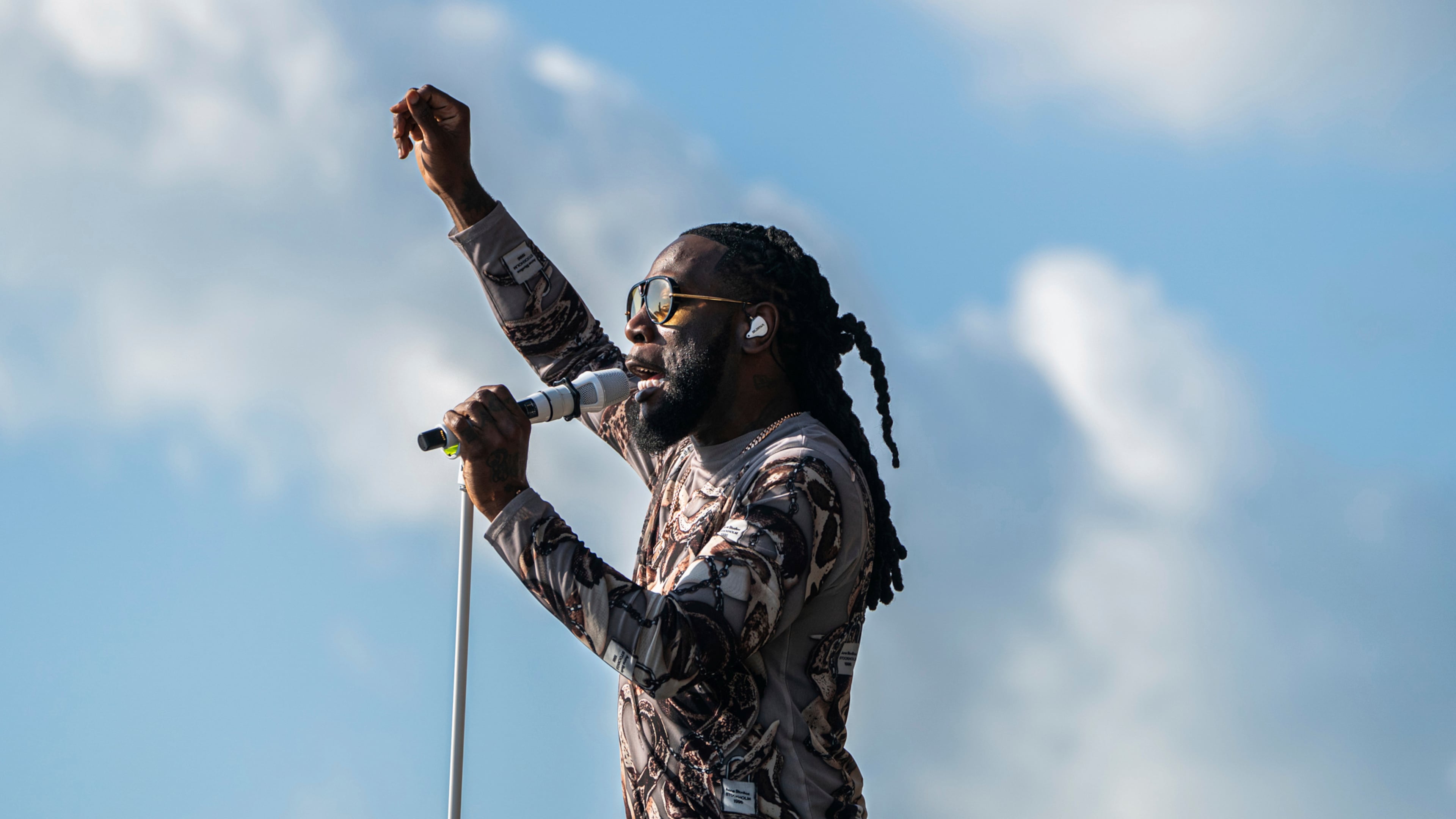 FILE - Burna Boy performs during the first weekend of the New Orleans Jazz & Heritage Festival on April 27, 2025, at Fair Grounds Race Course in New Orleans. (Photo by Amy Harris/Invision/AP, File)