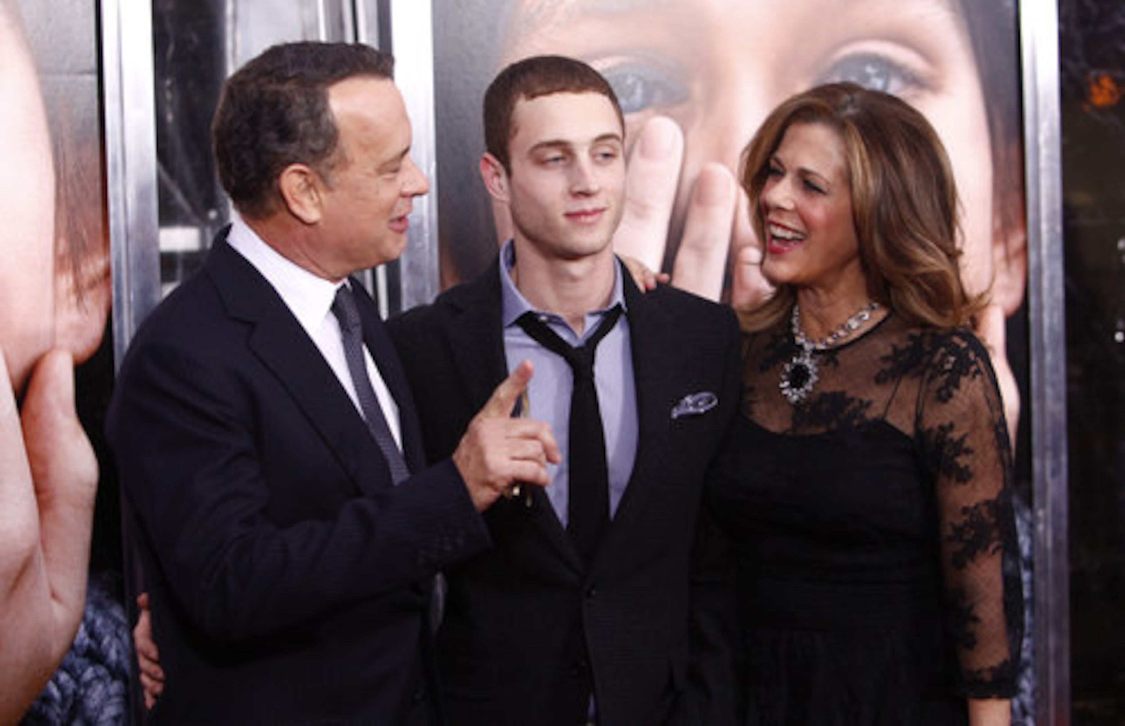 Tom Hanks and wife Rita Wilson pose with their son Chester Hanks on the red carpet.