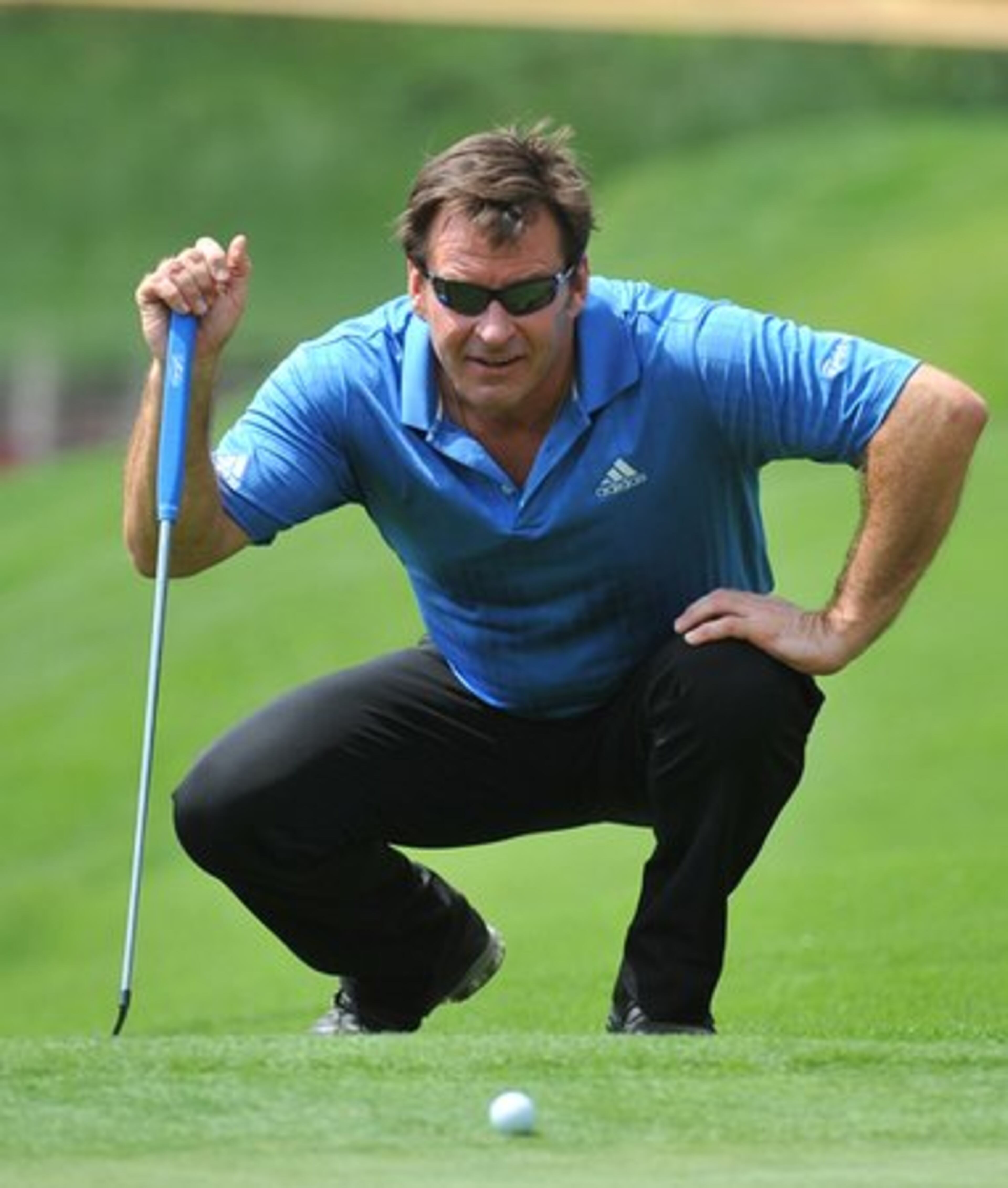 Nick Faldo lines up his putt on the 4th green during the par three contest at Augusta National Wednesday April 7, 2010.