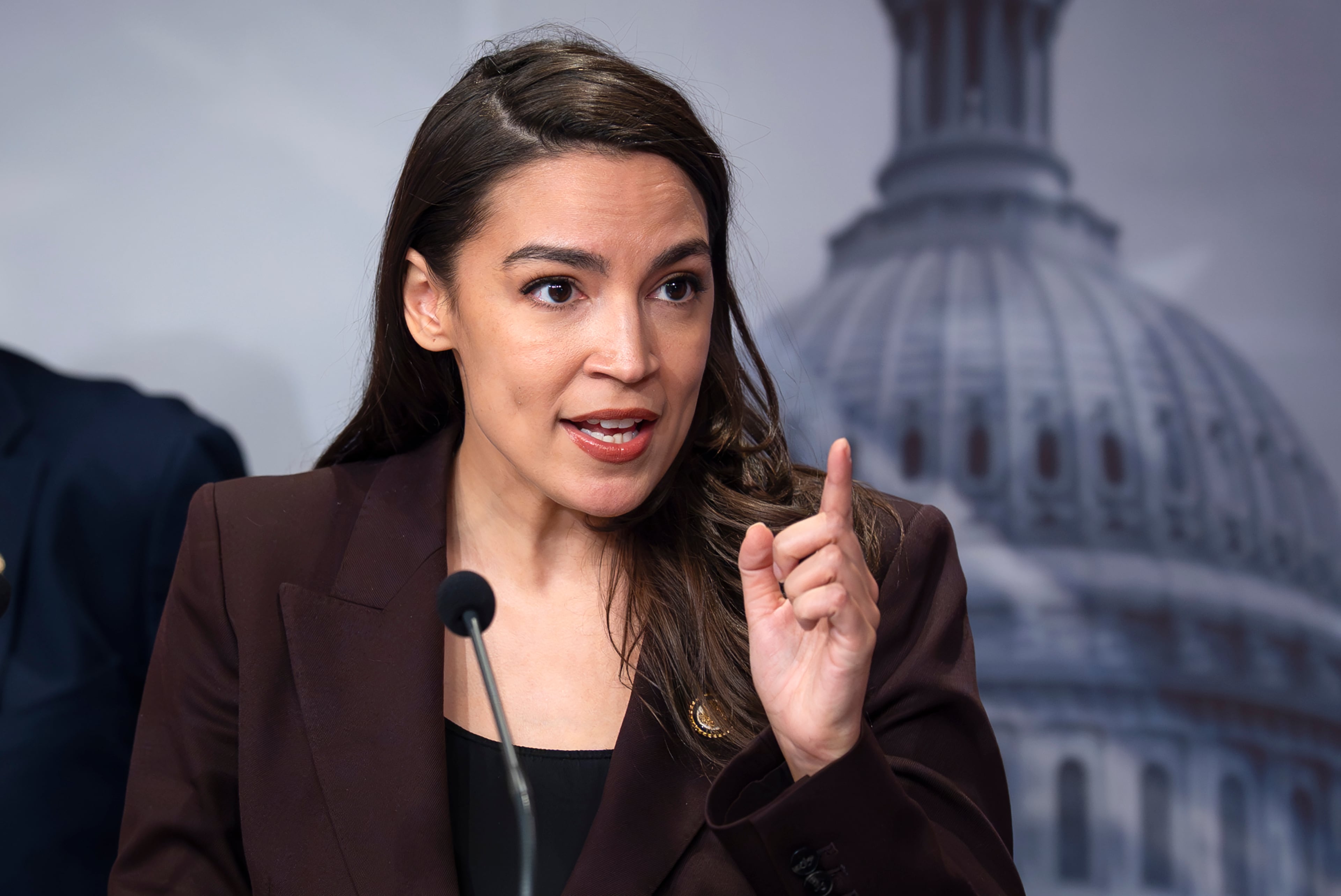 U.S. Rep. Alexandria Ocasio Cortez, D-N.Y., speaks during a Washington news conference in March, but attended Sunday services at Ebenezer Baptist Church. (J. Scott Applewhite/AP)