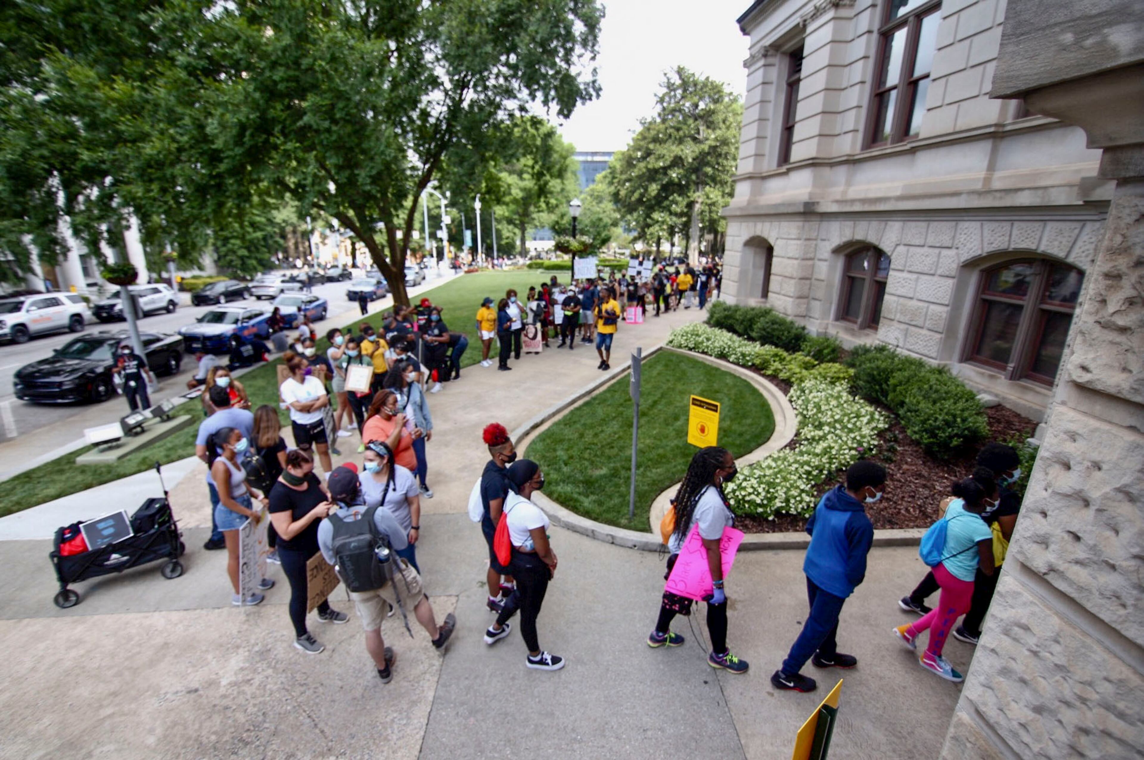 June 15, 2020 - Atlanta - Protesters line up to enter the Capitol. The NAACP March to the Capitol coincided with the restart of the Georgia 2020 General Assembly. Lawmakers returned wearing masks and followed new rules to restart the session during the pandemic. Steve Schaefer for the Atlanta Journal Constitution