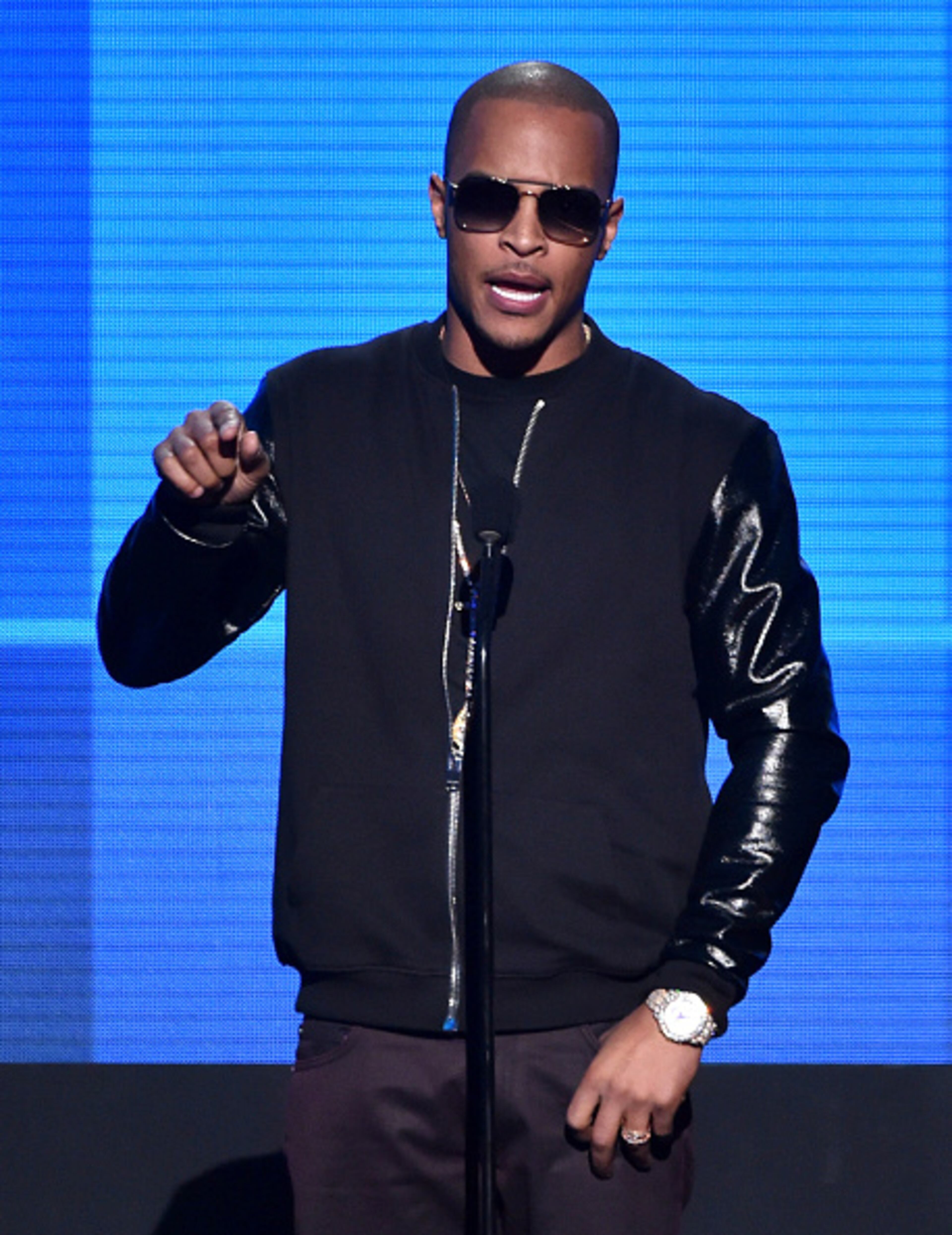 LOS ANGELES, CA - NOVEMBER 23: Recording artist T.I. speaks onstage at the 2014 American Music Awards at Nokia Theatre L.A. Live on November 23, 2014 in Los Angeles, California. (Photo by Kevin Winter/Getty Images)