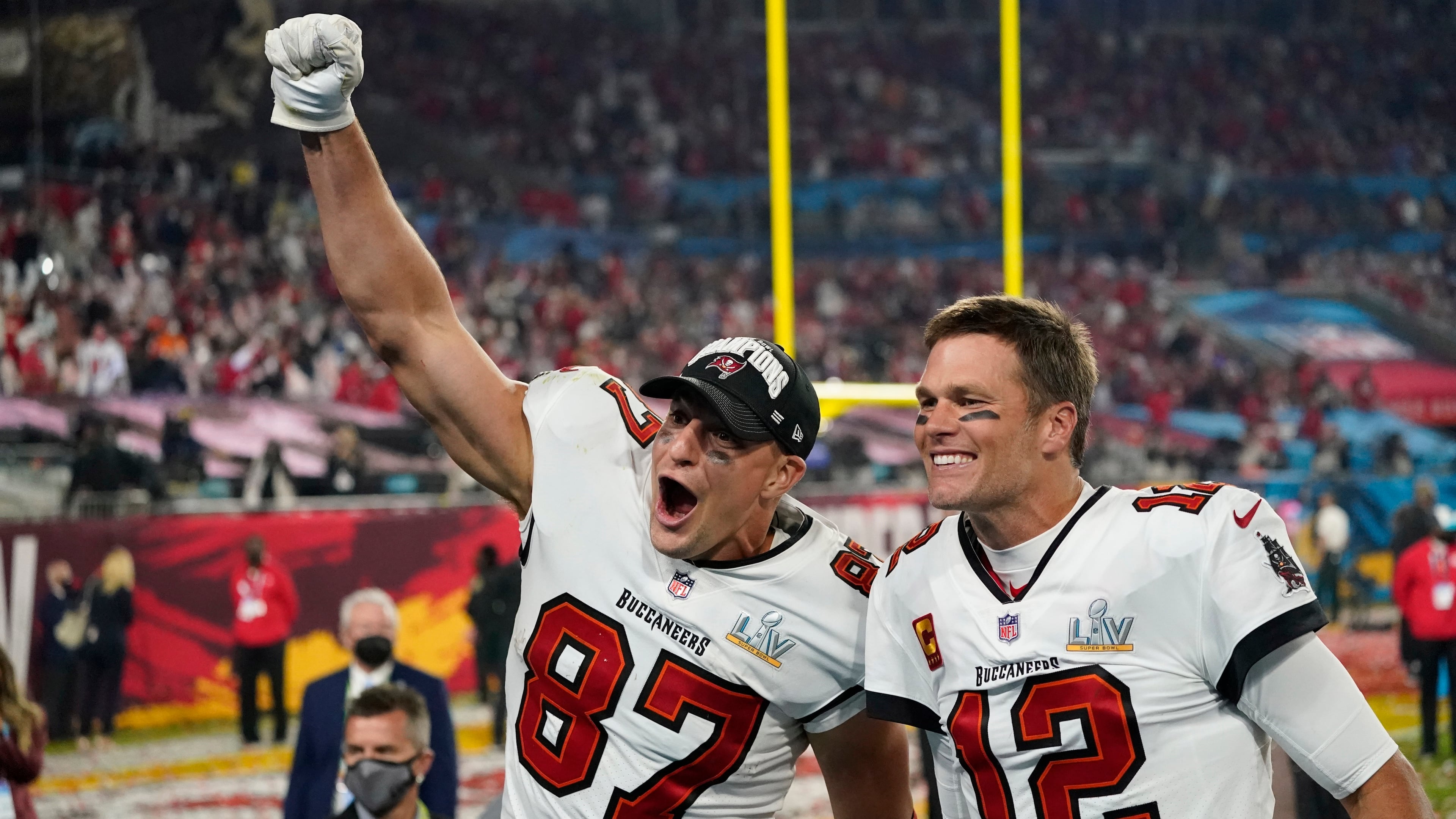 Tampa Bay Buccaneers tight end Rob Gronkowski (left) and quarterback Tom Brady celebrate after defeating the Kansas City Chiefs 31-9 in Super Bowl 55 Sunday, Feb. 7, 2021, in Tampa, Fla. It was the teammates' fourth NFL title together as member of the Bucs and New England Patriots. (AP Photo/Ashley Landis)