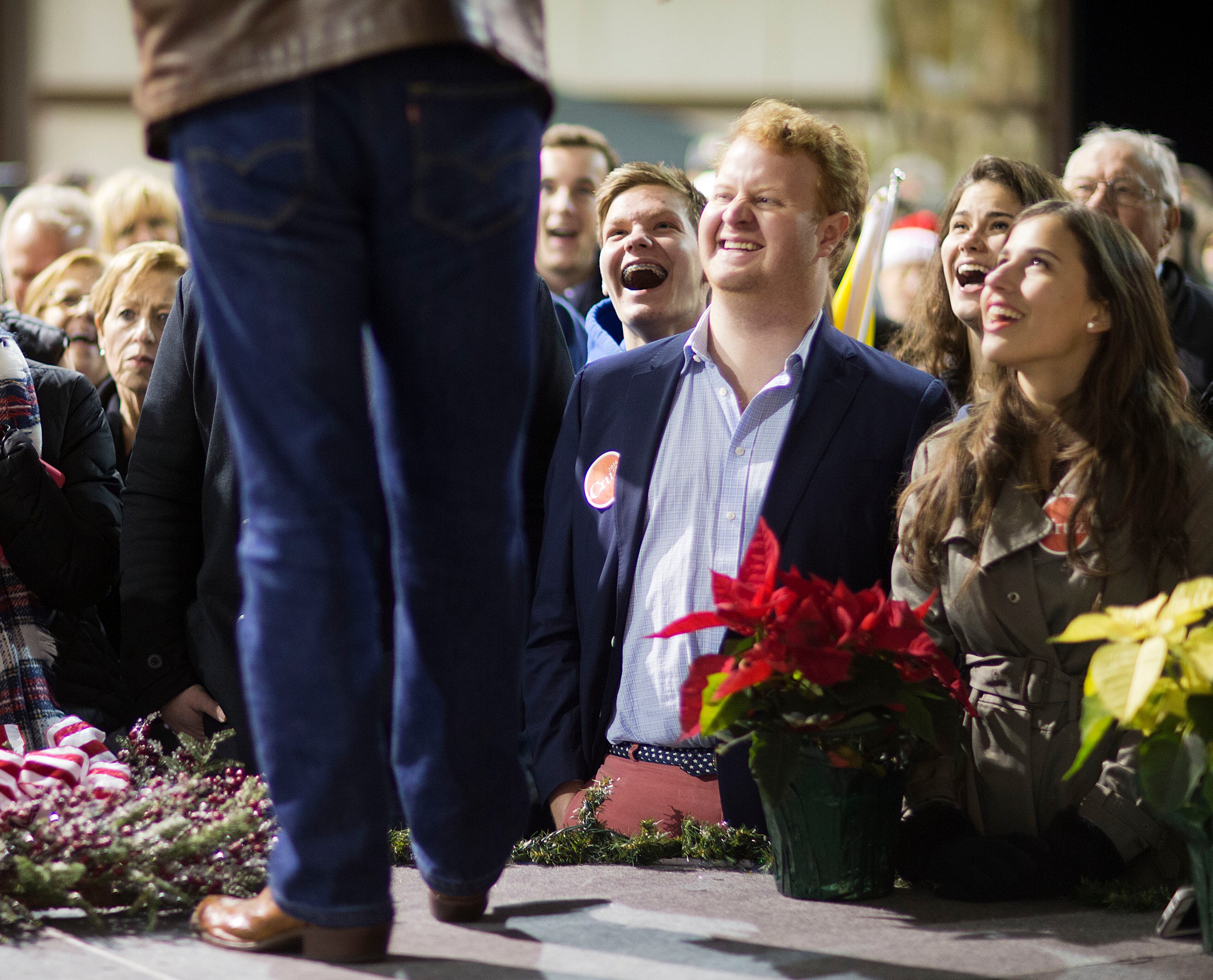 Members of the crowd watch as Republican presidential candidate, Sen. Ted Cruz, R-Texas, speaks during a campaign event in an airport hanger Friday, Dec. 18, 2015, in Kennesaw, Ga. (AP Photo/David Goldman)