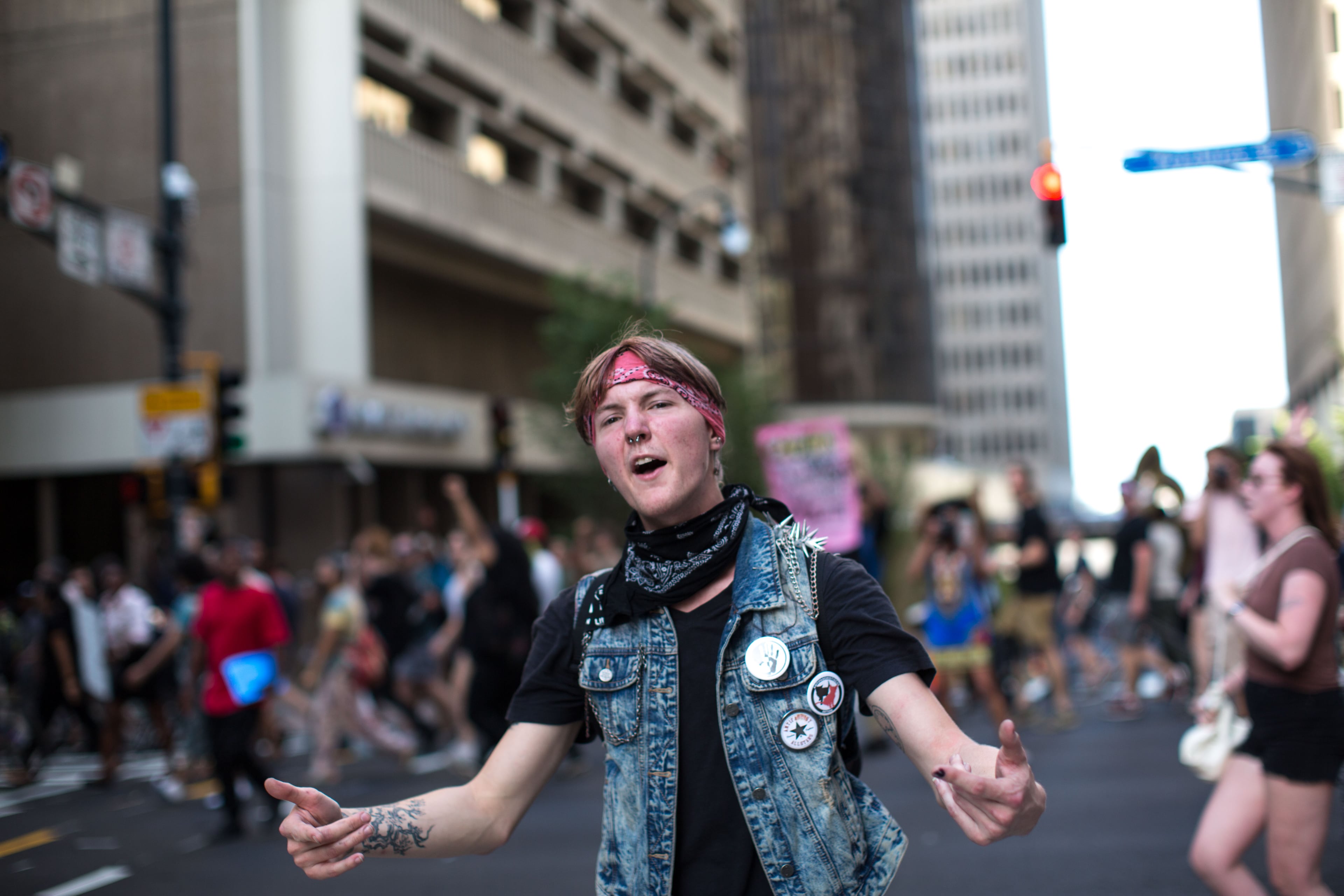 A man blocks traffic as demonstrators march from Underground Atlanta to Piedmont Park, Thursday, July 7, 2016, in Atlanta. They gathered in response to the death of Alton Sterling, 37, who was killed by Baton Rouge police outside of a convenience store where he was selling CDs, and Philando Castile, who was shot and killed when Minnesota police stopped him for a traffic violation on Wednesday evening. BRANDEN CAMP/SPECIAL