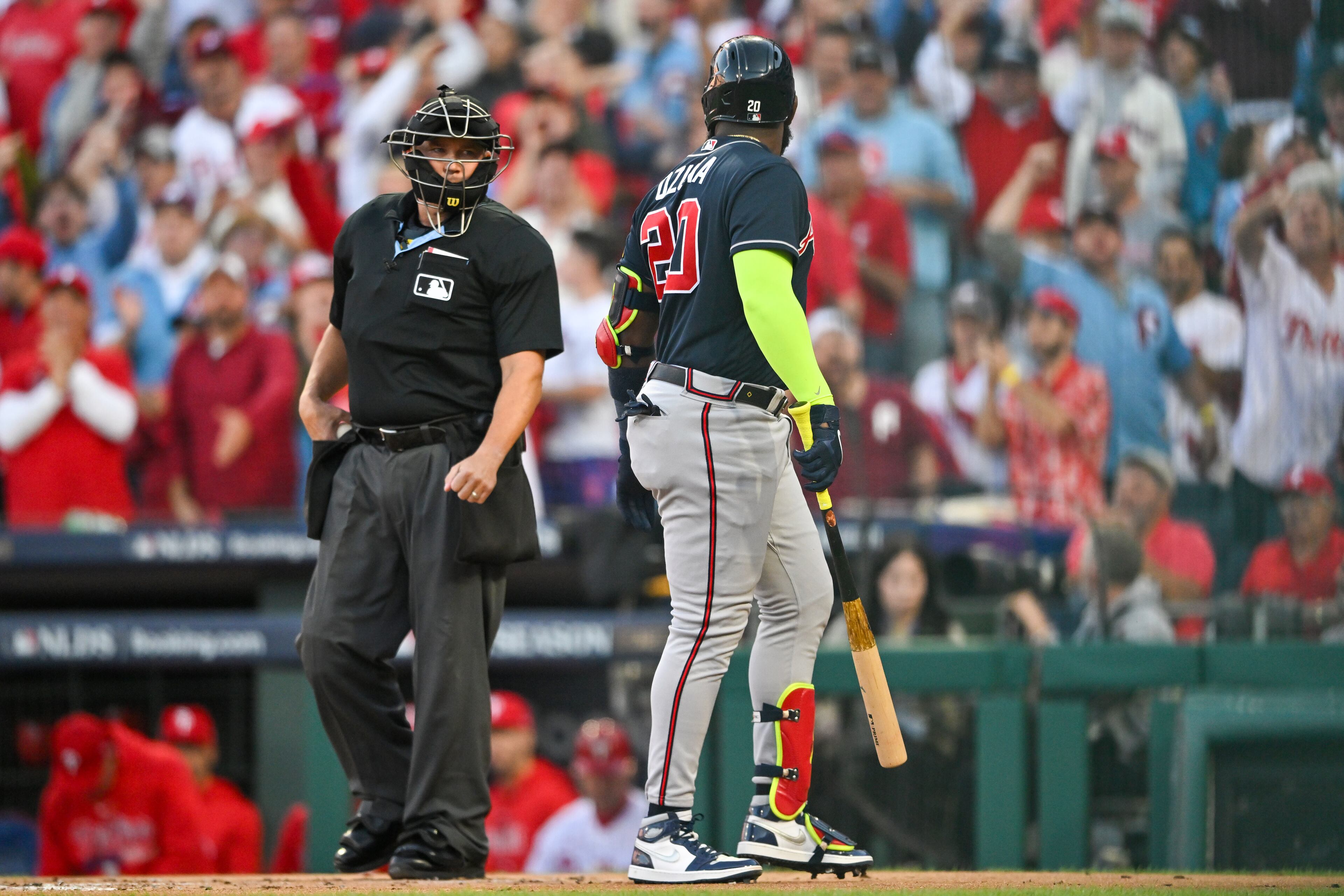 Atlanta Braves’ Marcell Ozuna (20) strikes out against the Philadelphia Phillies and has a word with home plate umpire Mark Carlson to end the first inning of NLDS Game 3 in Philadelphia on Wednesday, Oct. 11, 2023. (Hyosub Shin / Hyosub.Shin@ajc.com)