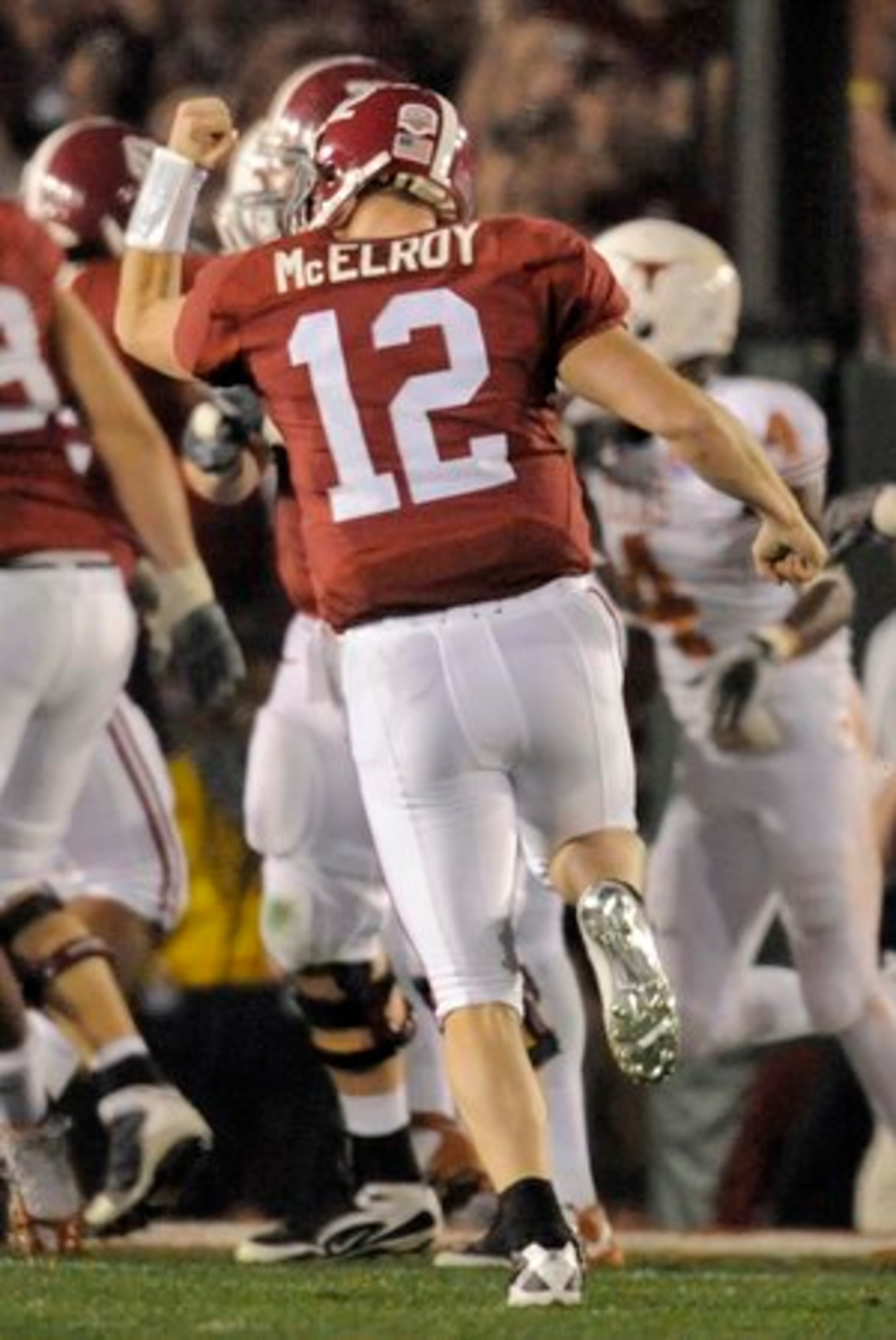 lAabama quarterback Greg McElroy (12) celebrates a touchdown during the second quarter.