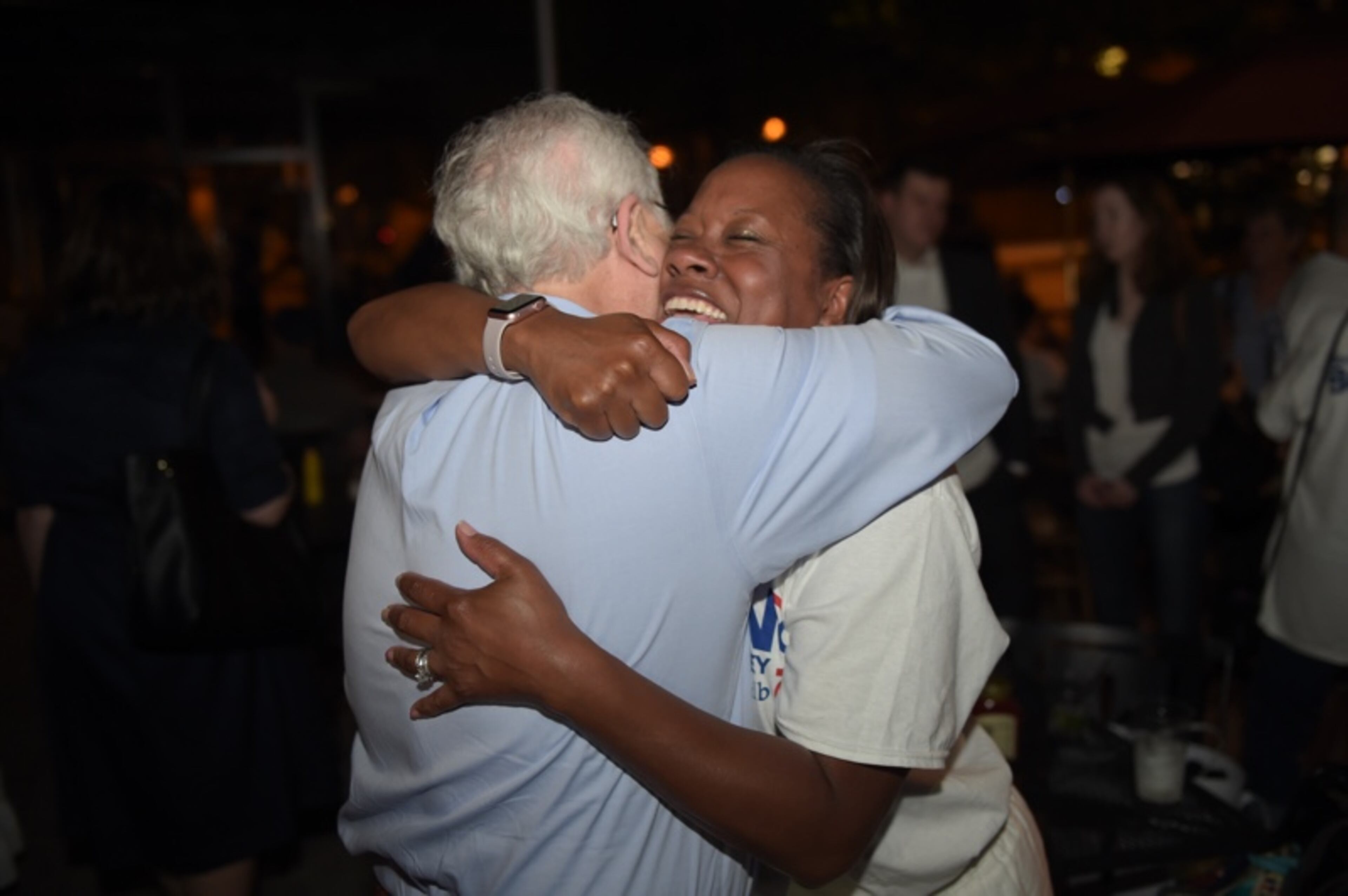 DeKalb DA candidate Sherry Boston celebrates with former prosecutor Bob Wilson at a watch party where she celebrated her win over incumbent Robert James during Tuesday's primary.