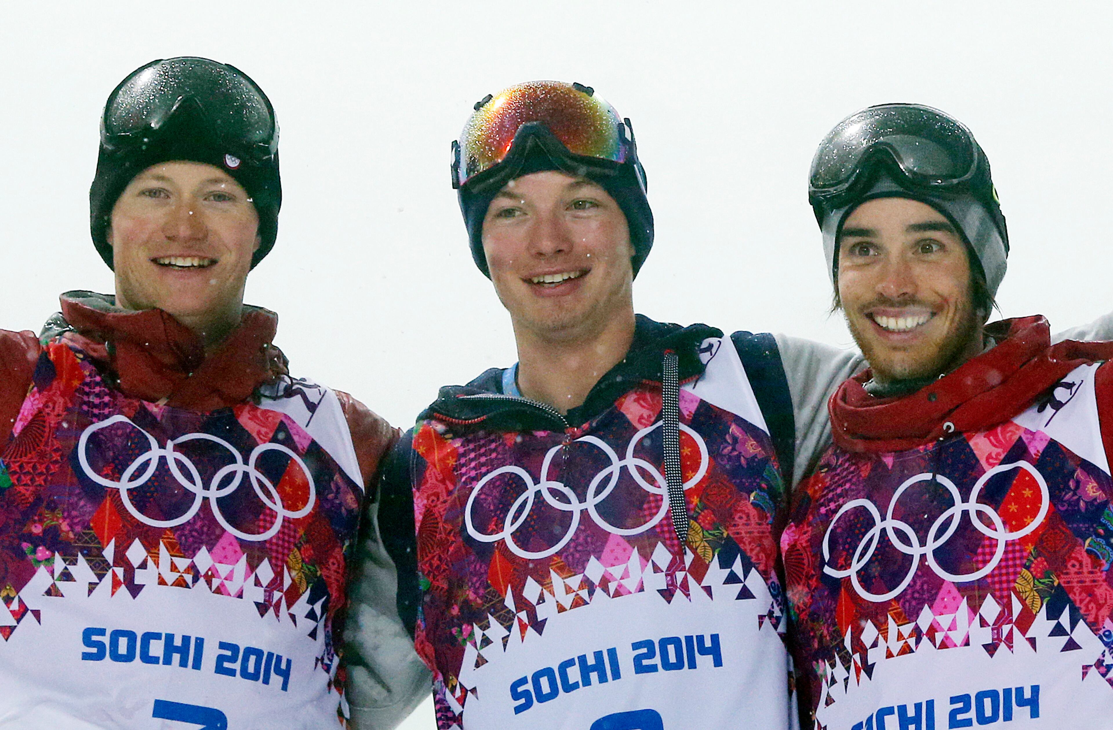 Gold medalist David Wise of the United States, center, celebrates with silver medalist Mike Riddle of Canada, left, and bronze medalist Kevin Rolland of France, after the men's ski halfpipe final at the Rosa Khutor Extreme Park, at the 2014 Winter Olympics, Tuesday, Feb. 18, 2014, in Krasnaya Polyana, Russia. (AP Photo/Sergei Grits)