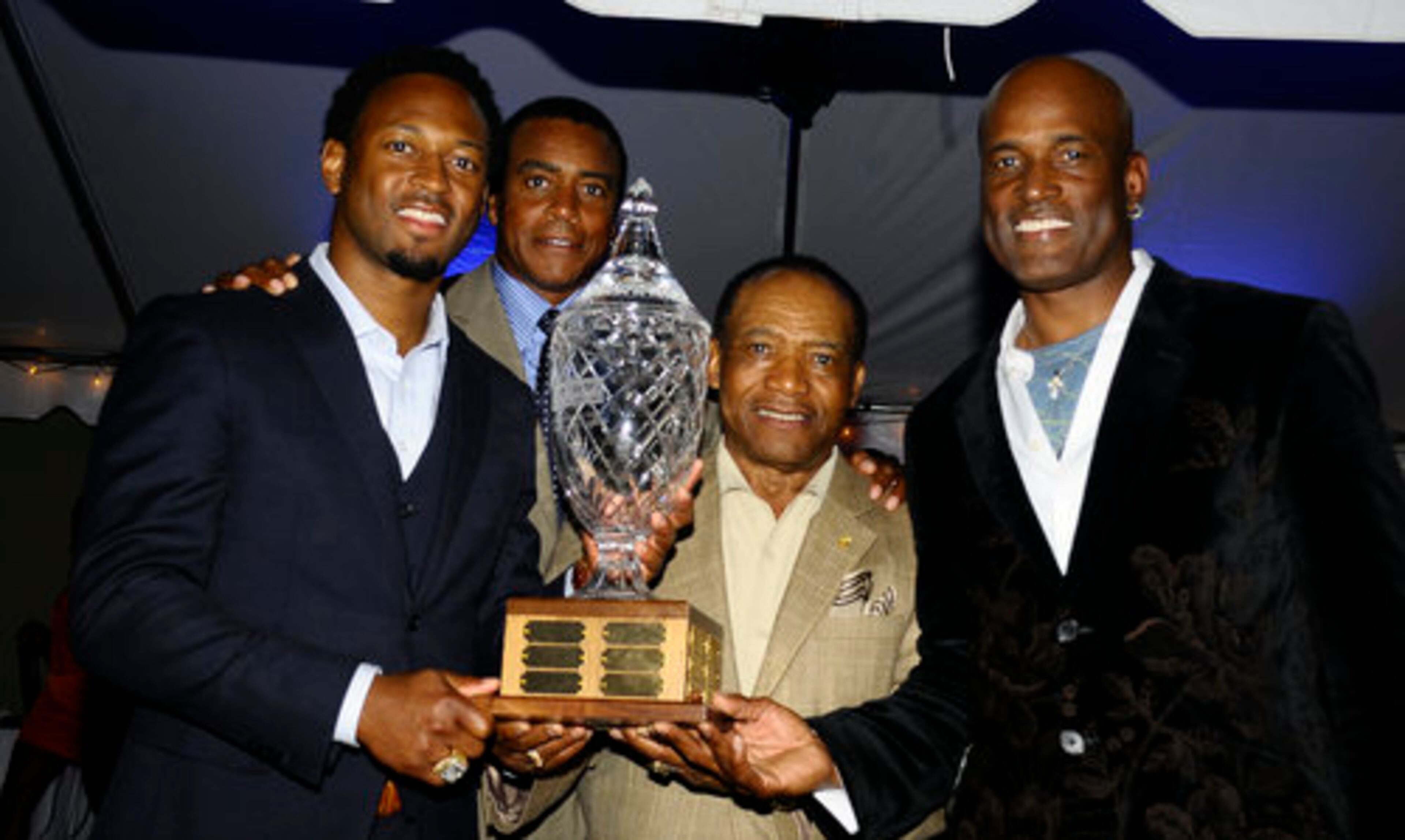 Kenny Leon and other members of the East Coast team celebrate their Kenny Cup win over Samuel Jackson's West Coast team.
