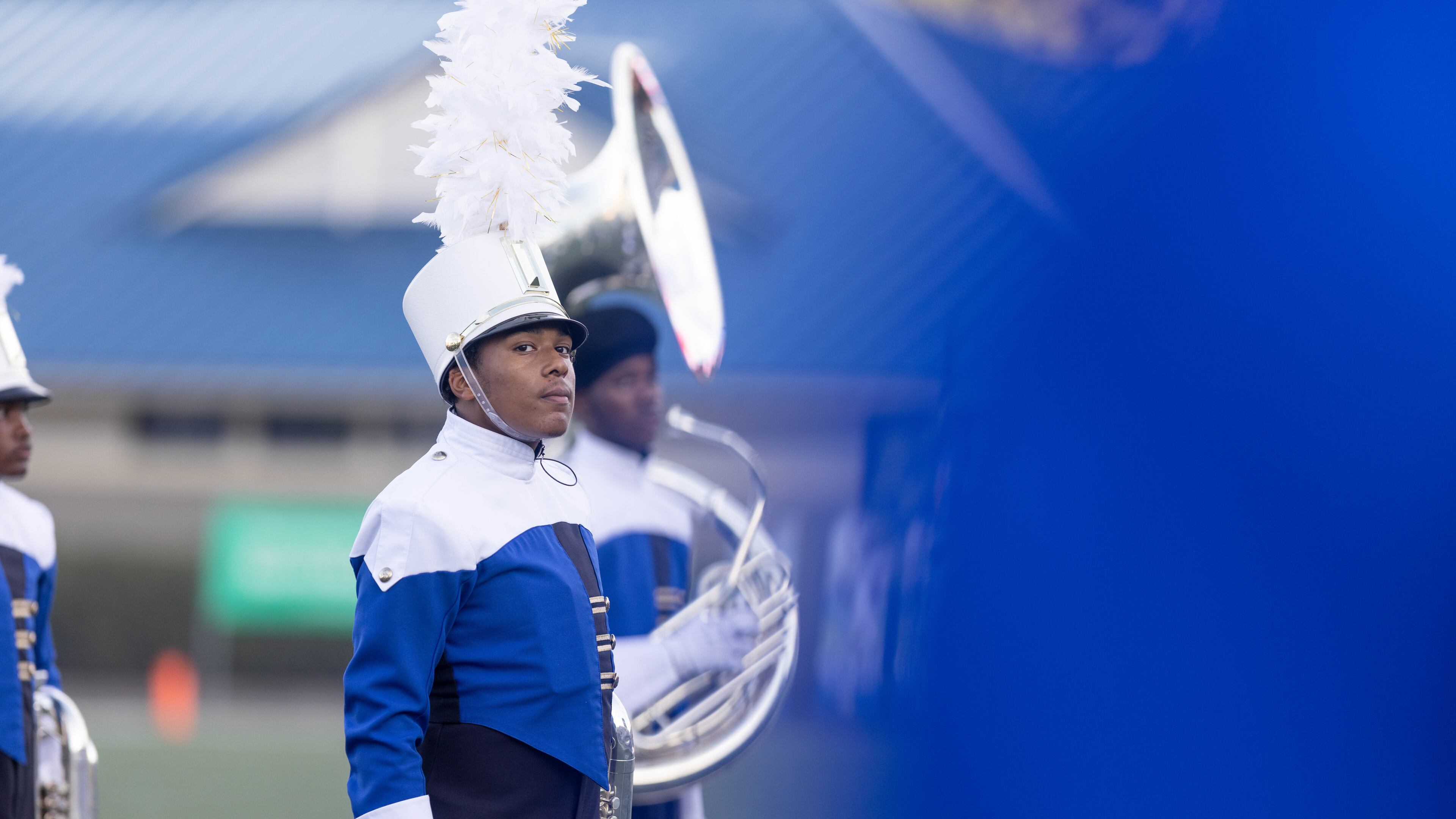 A McEachern band member stands before a GHSA High School football game between Langston Hughes High School and McEachern High School at McEachern High School in Powder Springs, GA., on Friday, August 26, 2022. (Photo by Jenn Finch)