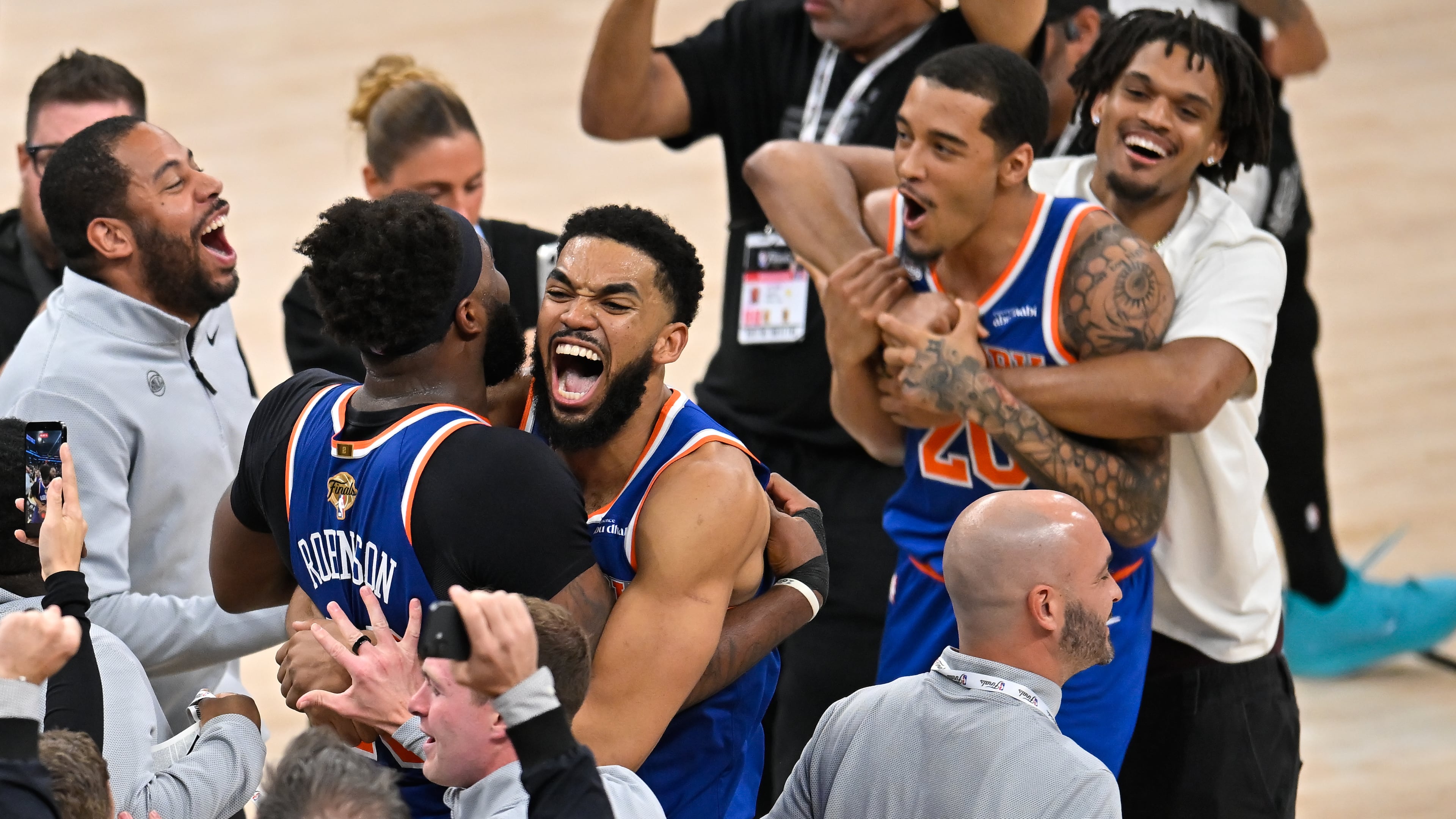 New York Knicks center Karl-Anthony Towns, right, hugs center Mitchell Robinson after defeating the San Antonio Spurs in Game 5 of the NBA Finals basketball series, Saturday, June 13, 2026, in San Antonio. (AP Photo/Darren Abate) CORRECTION: corrects ID to Mitchell Robinson instead Og Anunoby