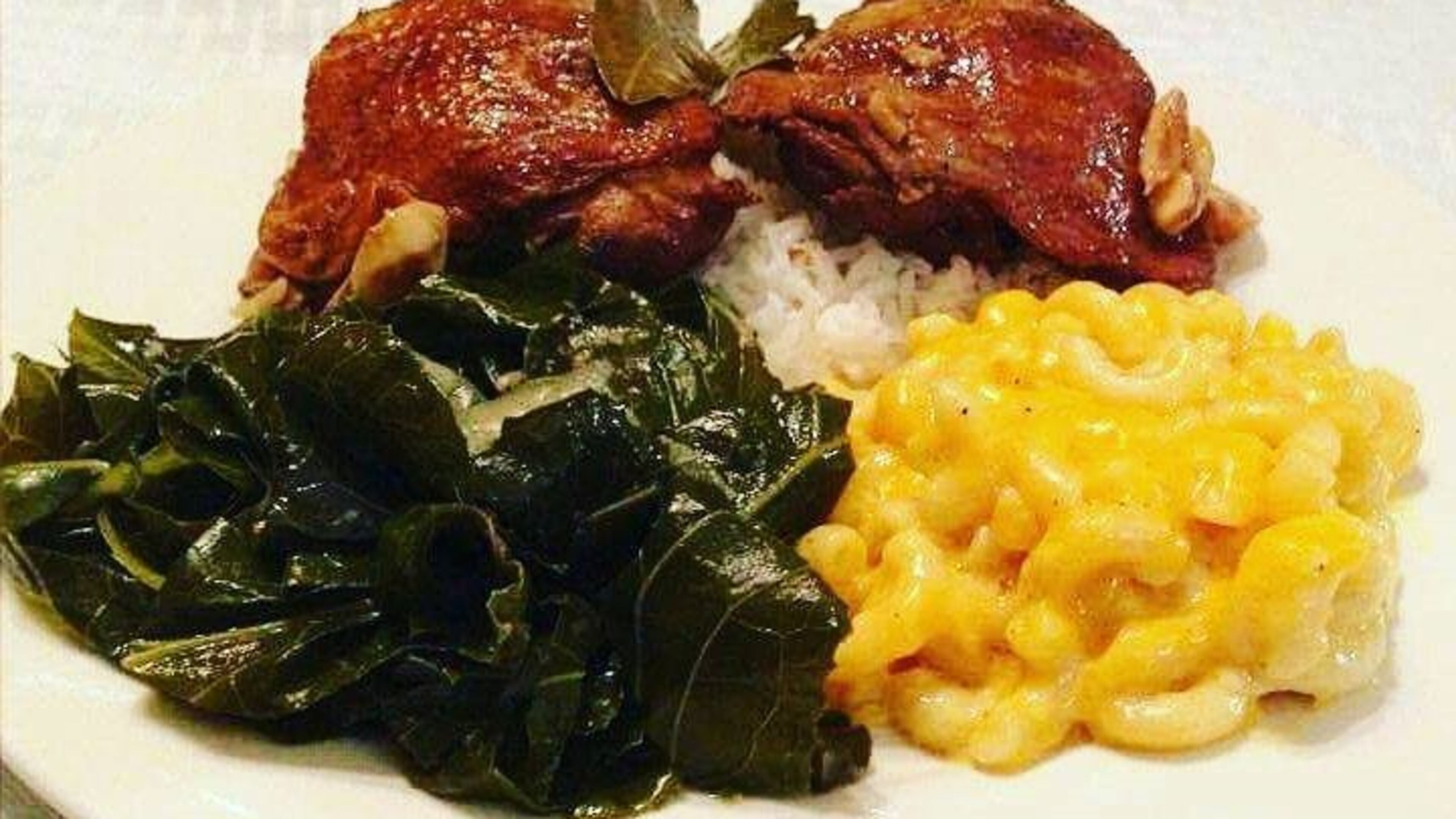 Adobo Chicken with mac n cheese and collards./ Photo: Janet's Kitchen