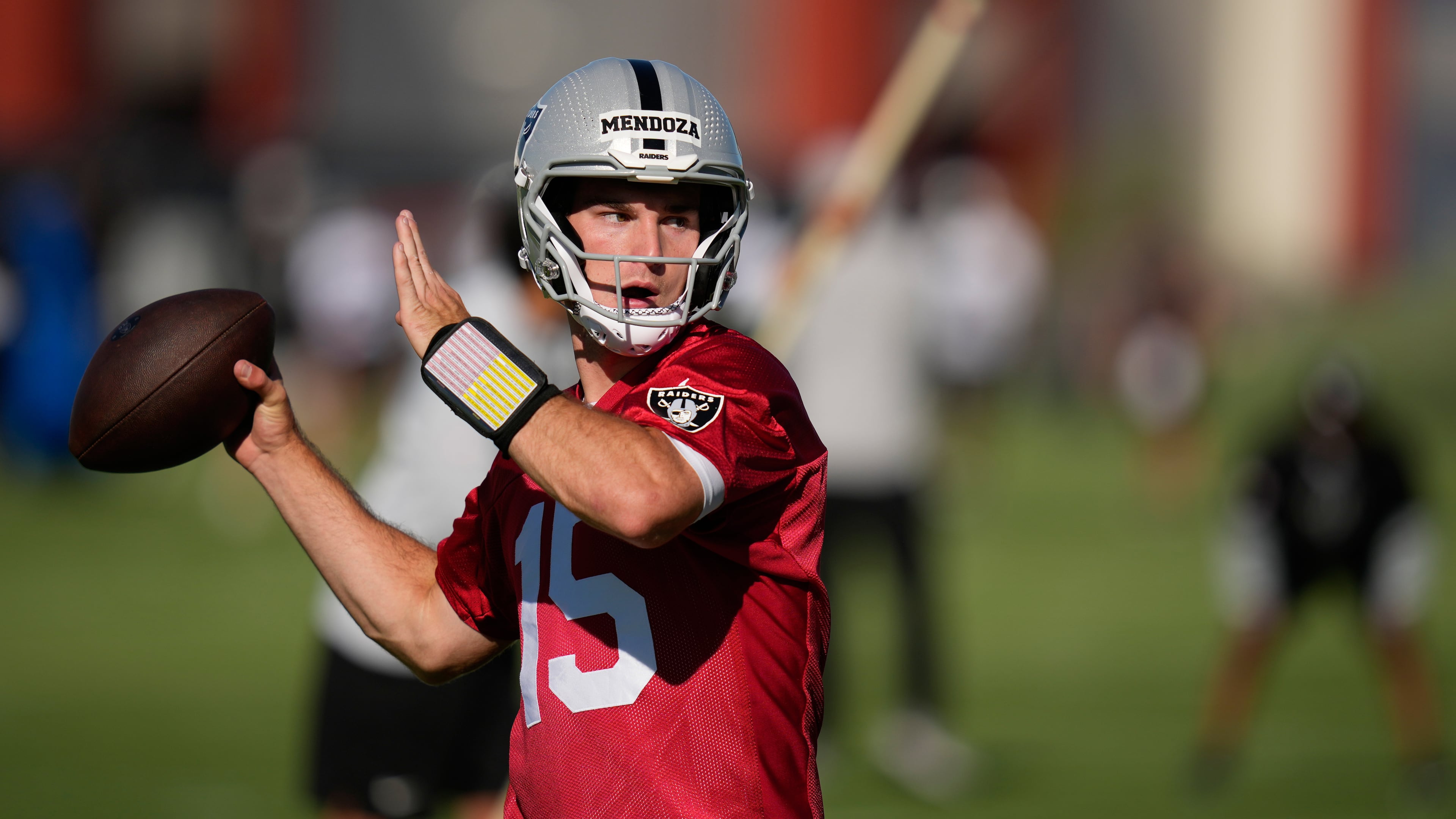 FILE - Las Vegas Raiders quarterback Fernando Mendoza throws during the NFL football team's practice Wednesday, June 10, 2026, in Henderson, Nev. (AP Photo/John Locher)