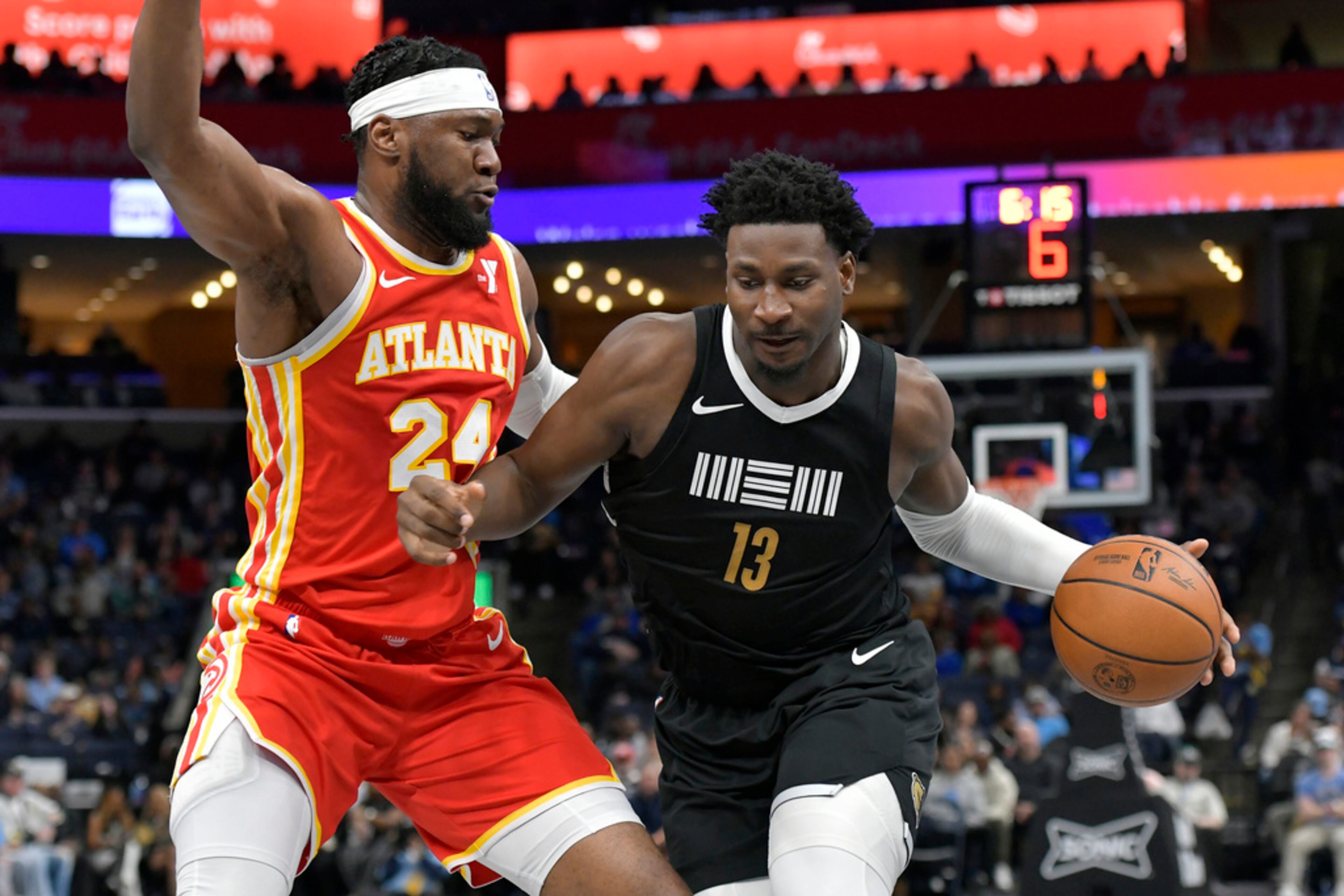 Memphis Grizzlies forward Jaren Jackson Jr. (13) drives against Atlanta Hawks forward Bruno Fernando (24) during the first half of an NBA basketball game Friday, March 8, 2024, in Memphis, Tenn. (AP Photo/Brandon Dill)