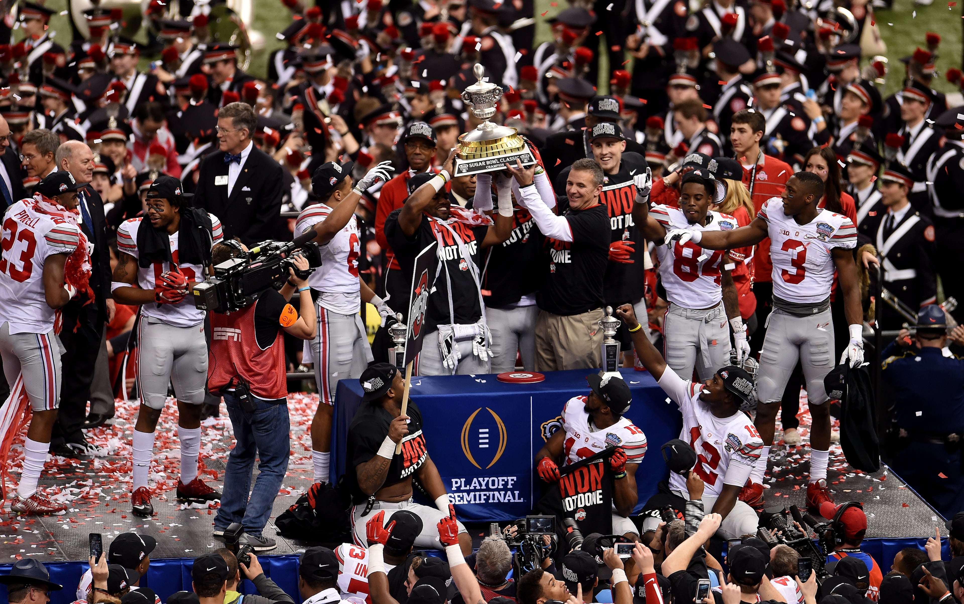 Head coach Urban Meyer and the Ohio State Buckeyes celebrate with the trophy after defeating the Alabama Crimson Tide in the All State Sugar Bowl at the Mercedes-Benz Superdome on January 1, 2015 in New Orleans, Louisiana. The Ohio State Buckeyes defeated the Alabama Crimson Tide 42 to 35. (Photo by Stacy Revere/Getty Images)