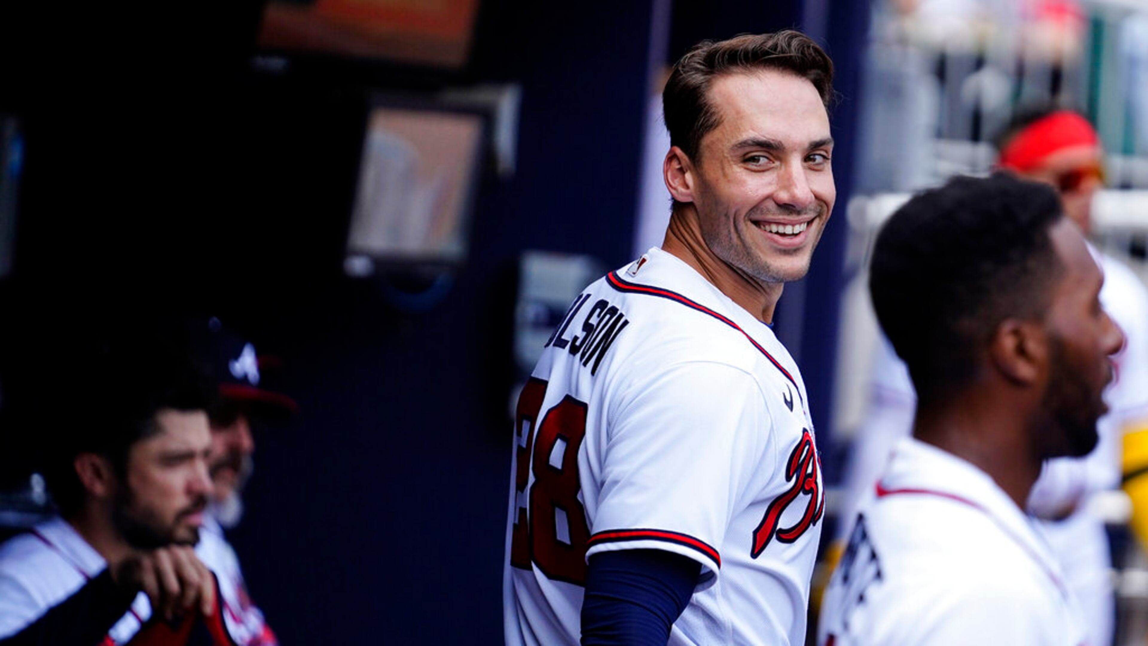 Atlanta Braves' Matt Olson (28) celebrates in the dugout after a home run in the first inning of a baseball game against the San Diego Padres, Saturday, May 14, 2022, in Atlanta. (AP Photo/Brynn Anderson)