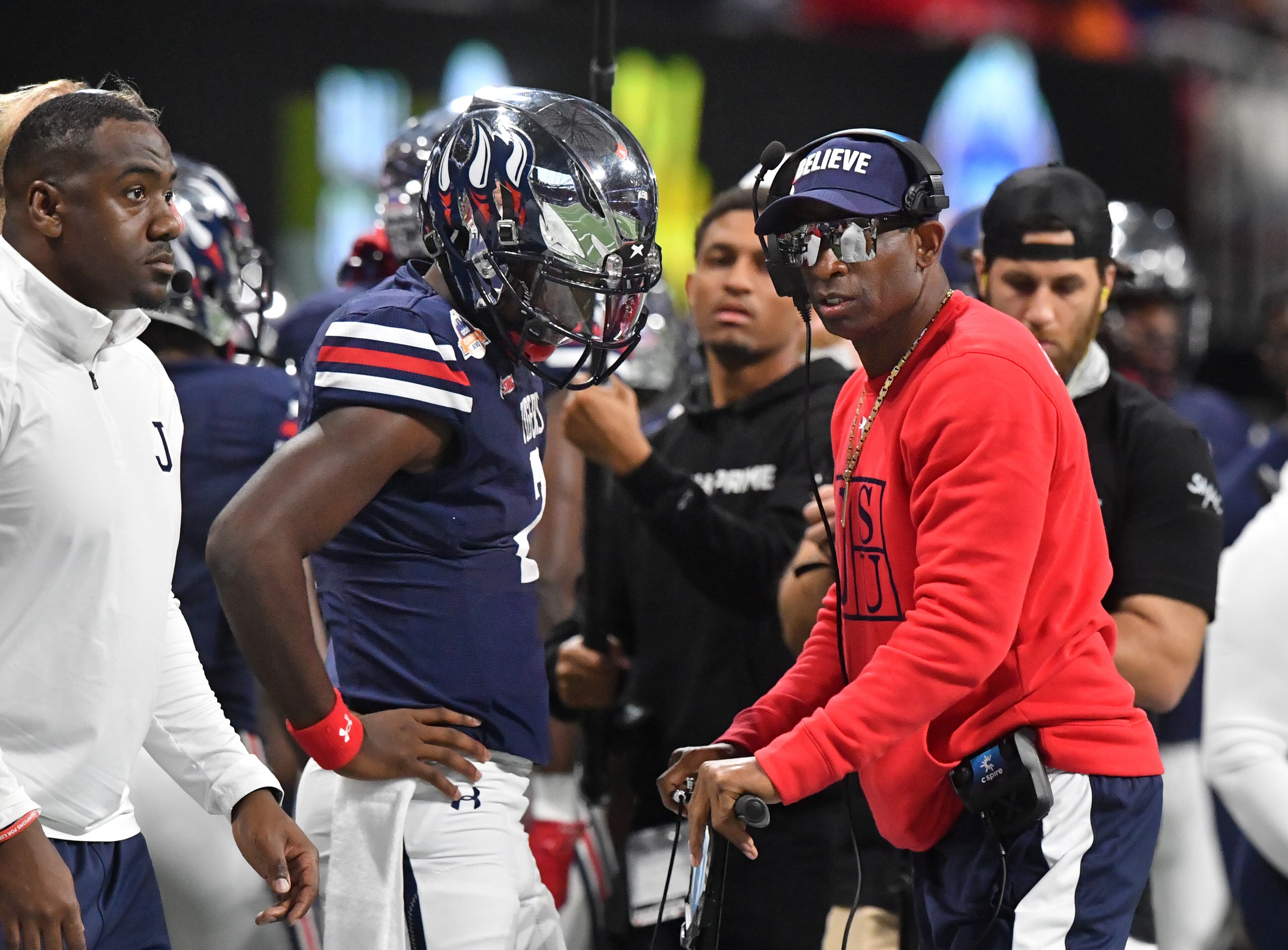 Jackson State's head coach Deion Sanders instructs his son and quarterback Shedeur Sanders (2) during the first half of the 2021 Cricket Celebration Bowl at Mercedes-Benz Stadium in Atlanta on Saturday, December 18, 2021. (Hyosub Shin / Hyosub.Shin@ajc.com)