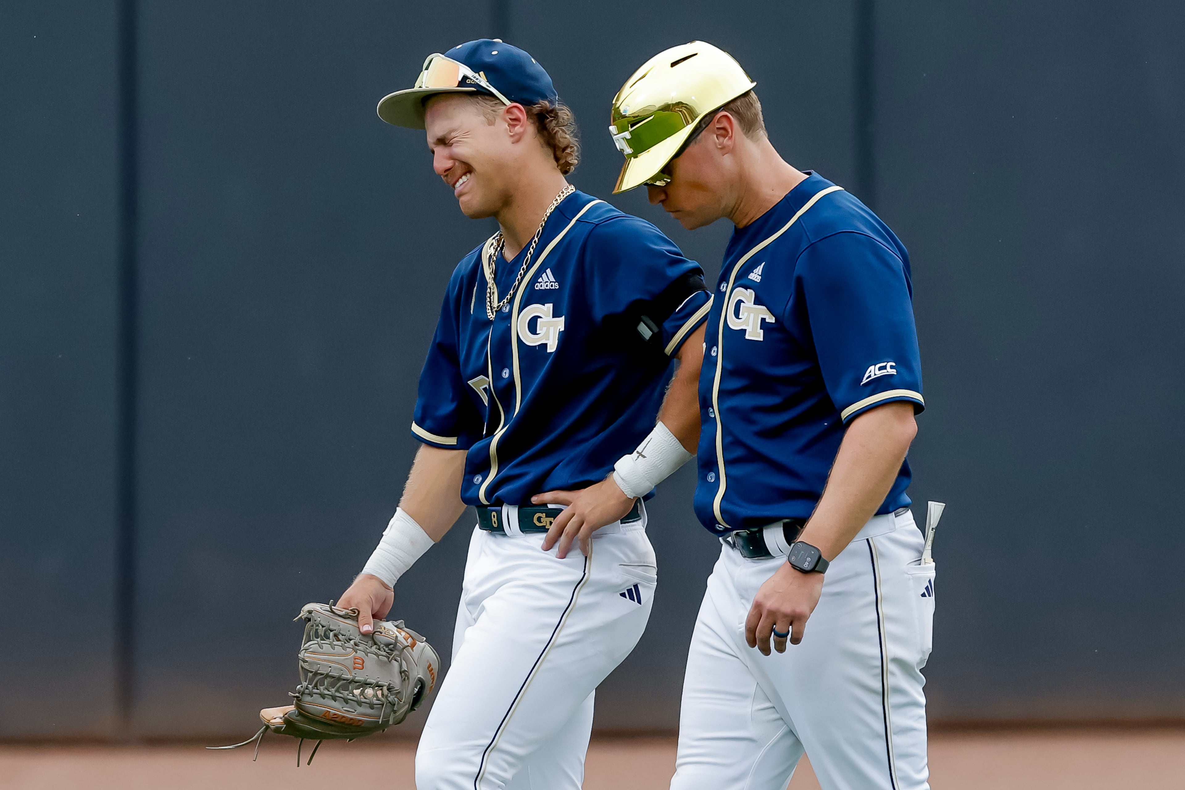 Georgia Tech head coach James Ramsey (right) consoles Drew Burress after Oklahoma hit a solo home run against Tech during the 10th inning to win the Atlanta Regional elimination baseball game at Russ Chandler Stadium on Monday, June 1, 2026. (Erik S. Lesser for the AJC)