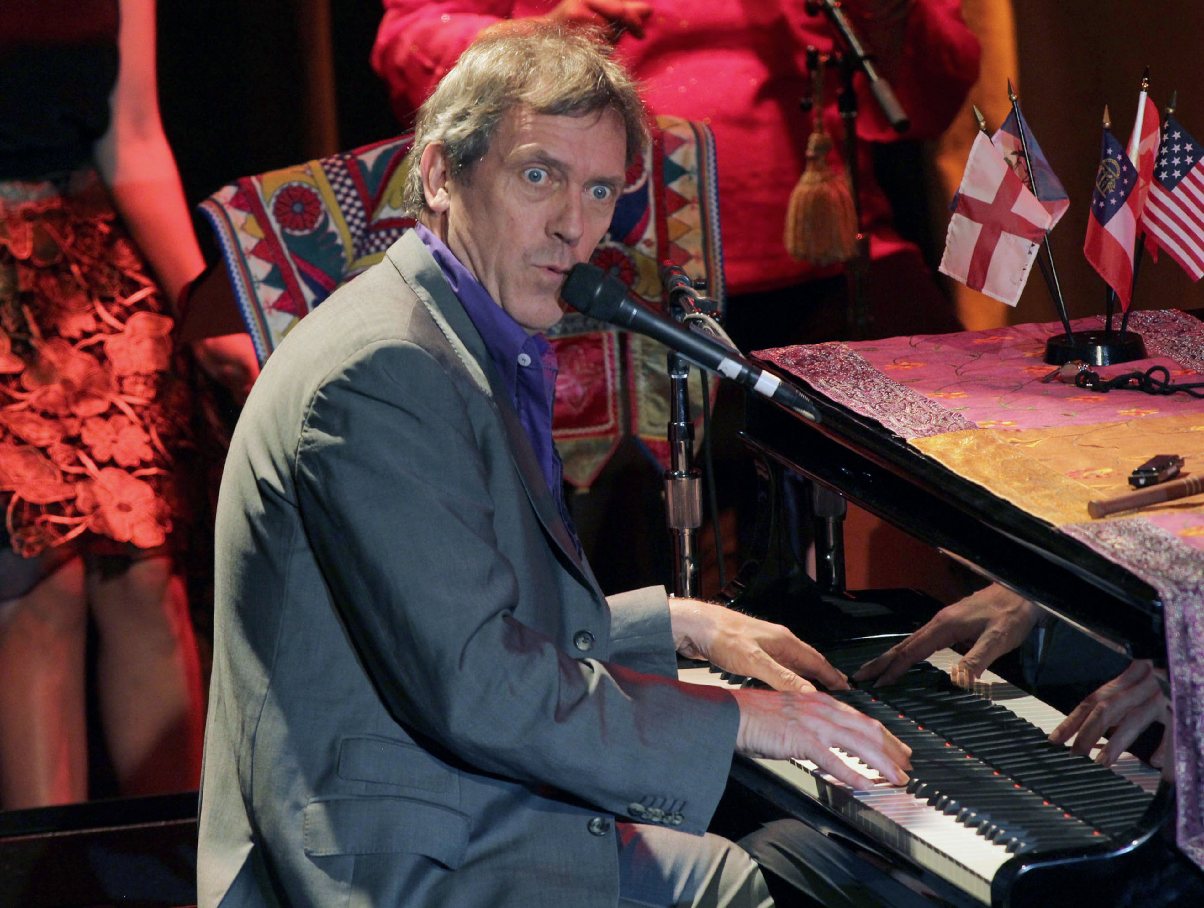 Hugh Laurie sings the classic blues number, "Let the Good Times Roll," Sunday, Nov. 3, 2013 at the Buckhead Theatre in Atlanta.