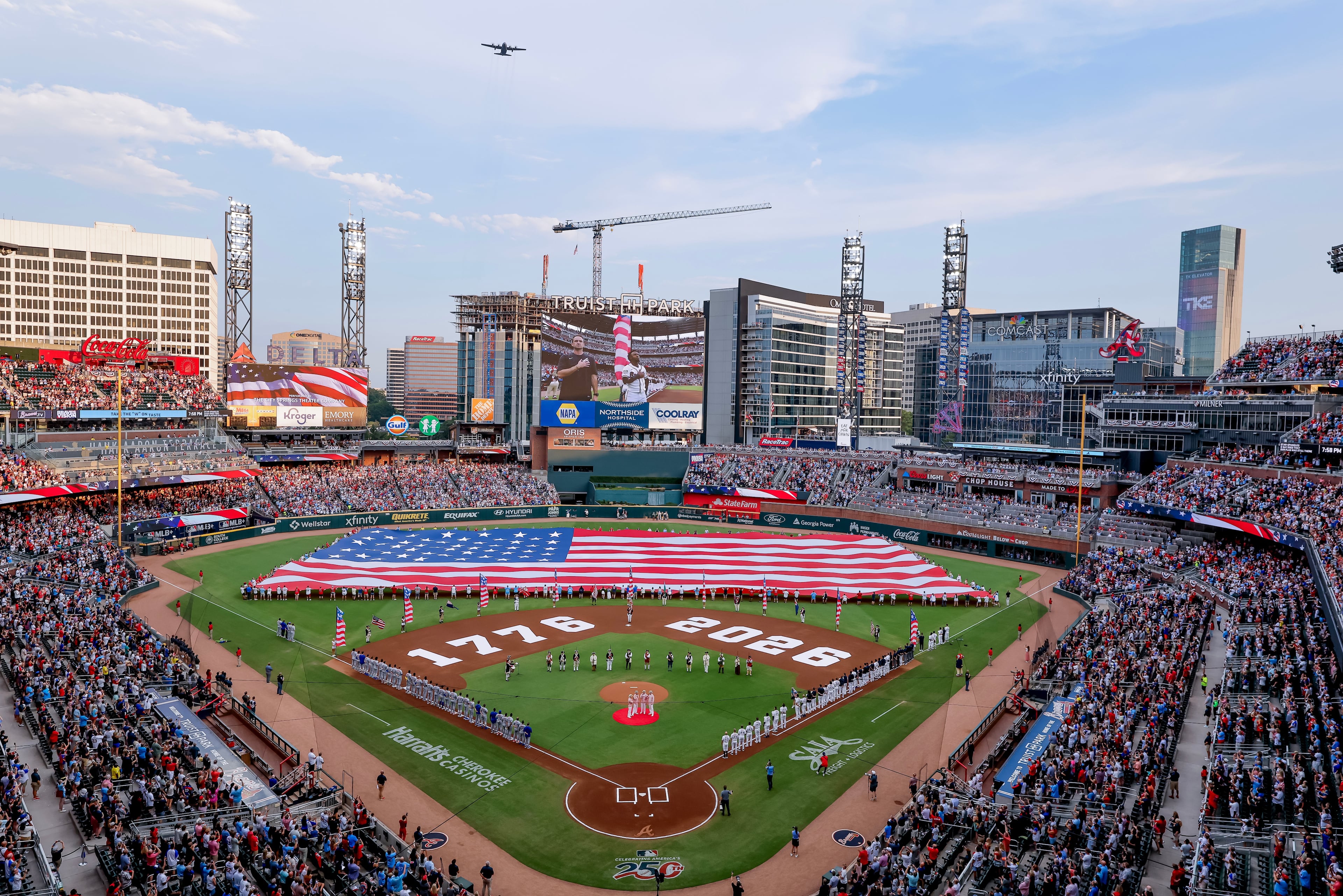 A Lockheed C-130H performs a flyover before the Braves and Mets clashed at Truist Park on July Fourth. (Erik S. Lesser/AP)