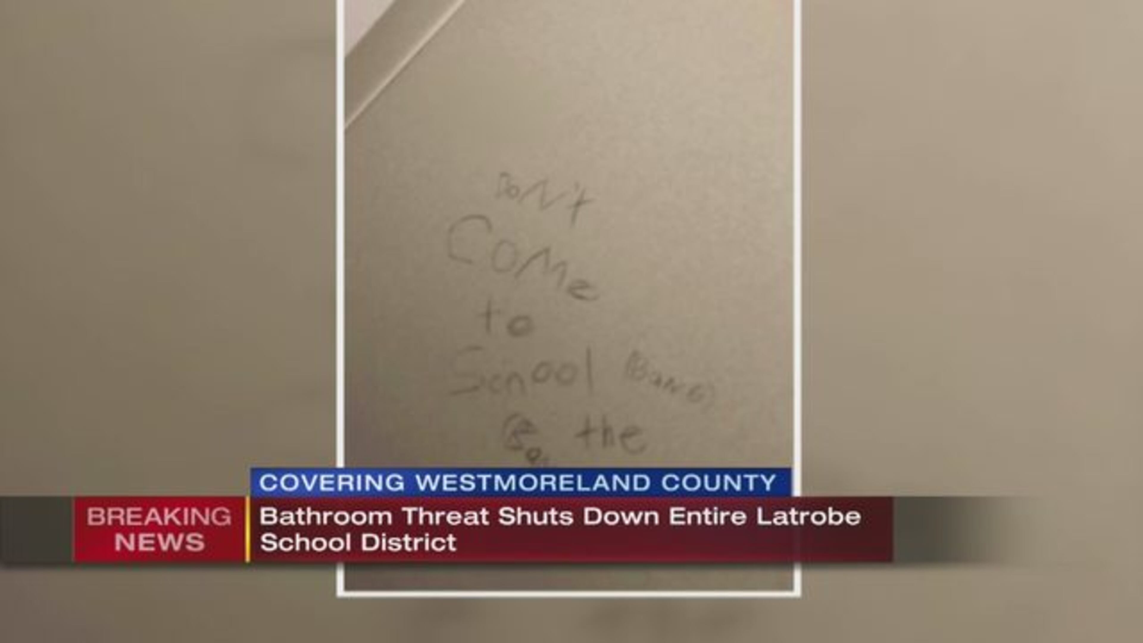 A threat written on a bathroom in a Latrobe, Pennsylvania school has led to the cancellation of classes on Friday.