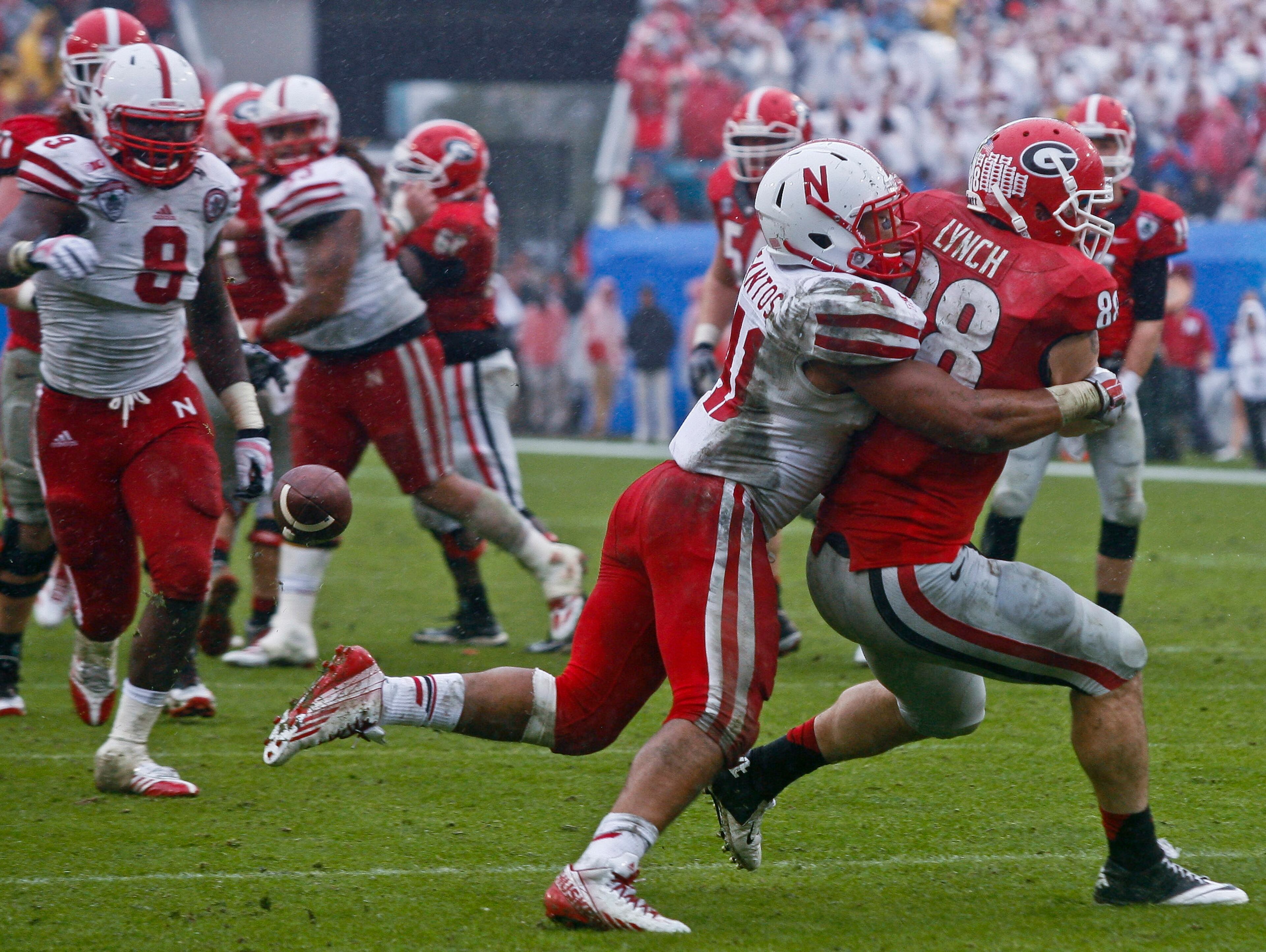 Cornhuskers linebacker David Santos (41) knocks a pass away from Georgia Bulldogs tight end Arthur Lynch (88) in the final seconds of the fourth quarter of their game at EverBank Field. The Nebraska Cornhuskers beat the Georgia Bulldogs 24-19.