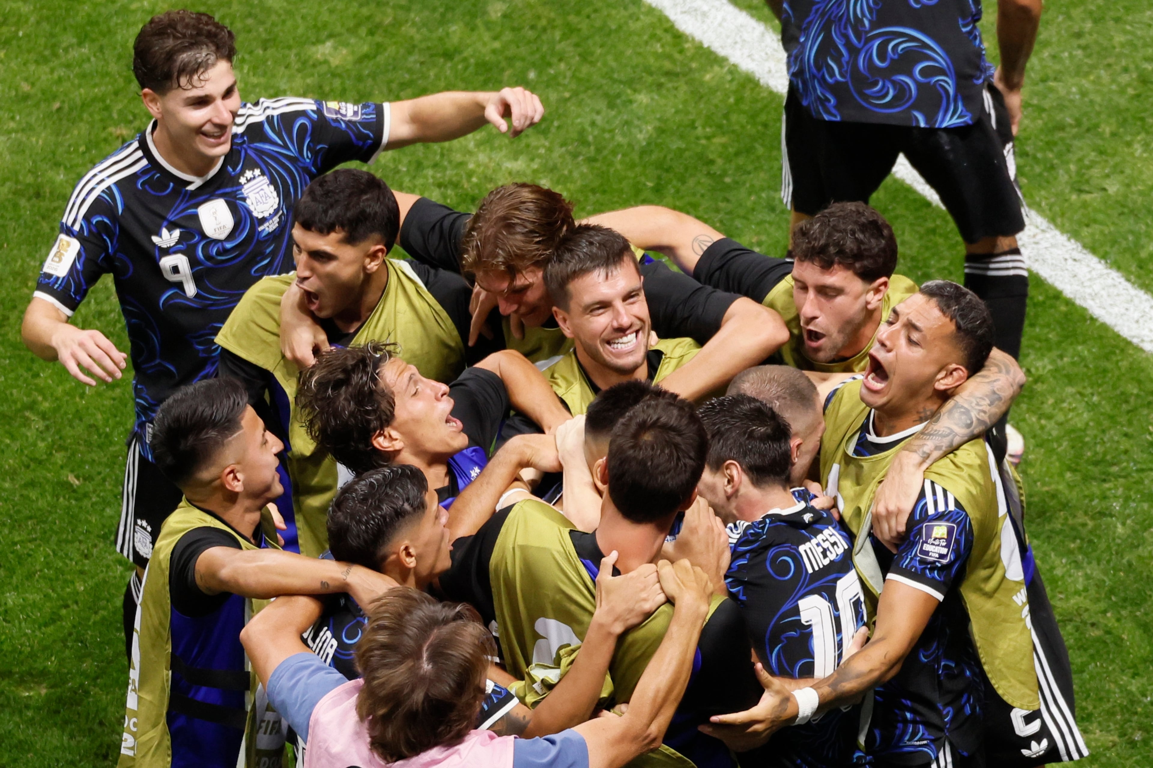 Argentina's Lautaro Martinez, (22), is mobbed by teammates after the winning goal during second half of Argentina vs. England FIFA World Cup Semifinal match at Atlanta Stadium (Mercedes-Benz Stadium) on Wednesday, July 15, 2026. (Miguel Martinez/AJC)