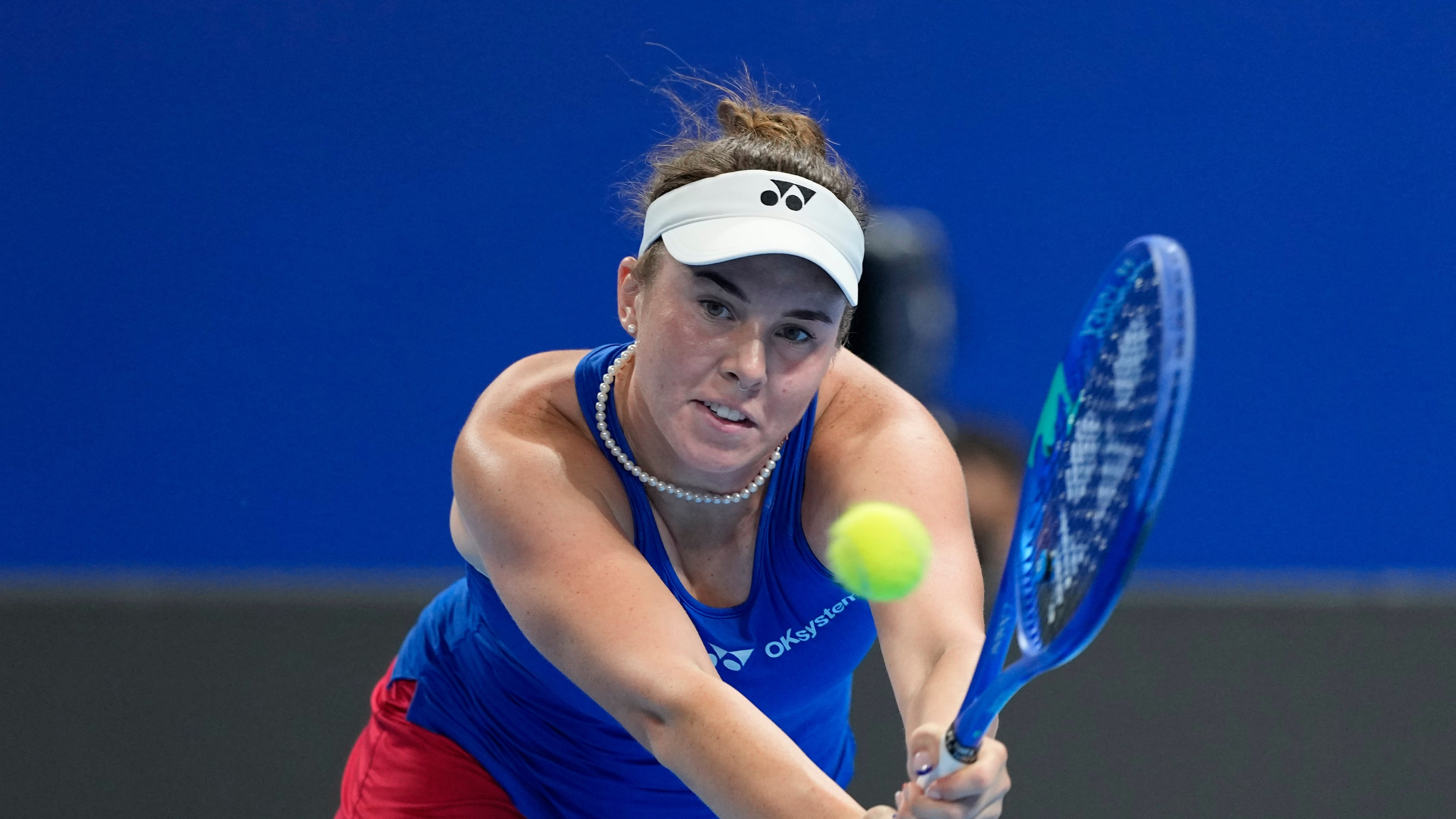 Linda Noskova of Czech Republic returns the ball to Katie Boulter of Britain in a quarterfinal match for the Billie Jean King Cup held in Shenzhen in southern China's Guangdong province, Tuesday, Sept. 22, 2026. (AP Photo/Andy Wong)