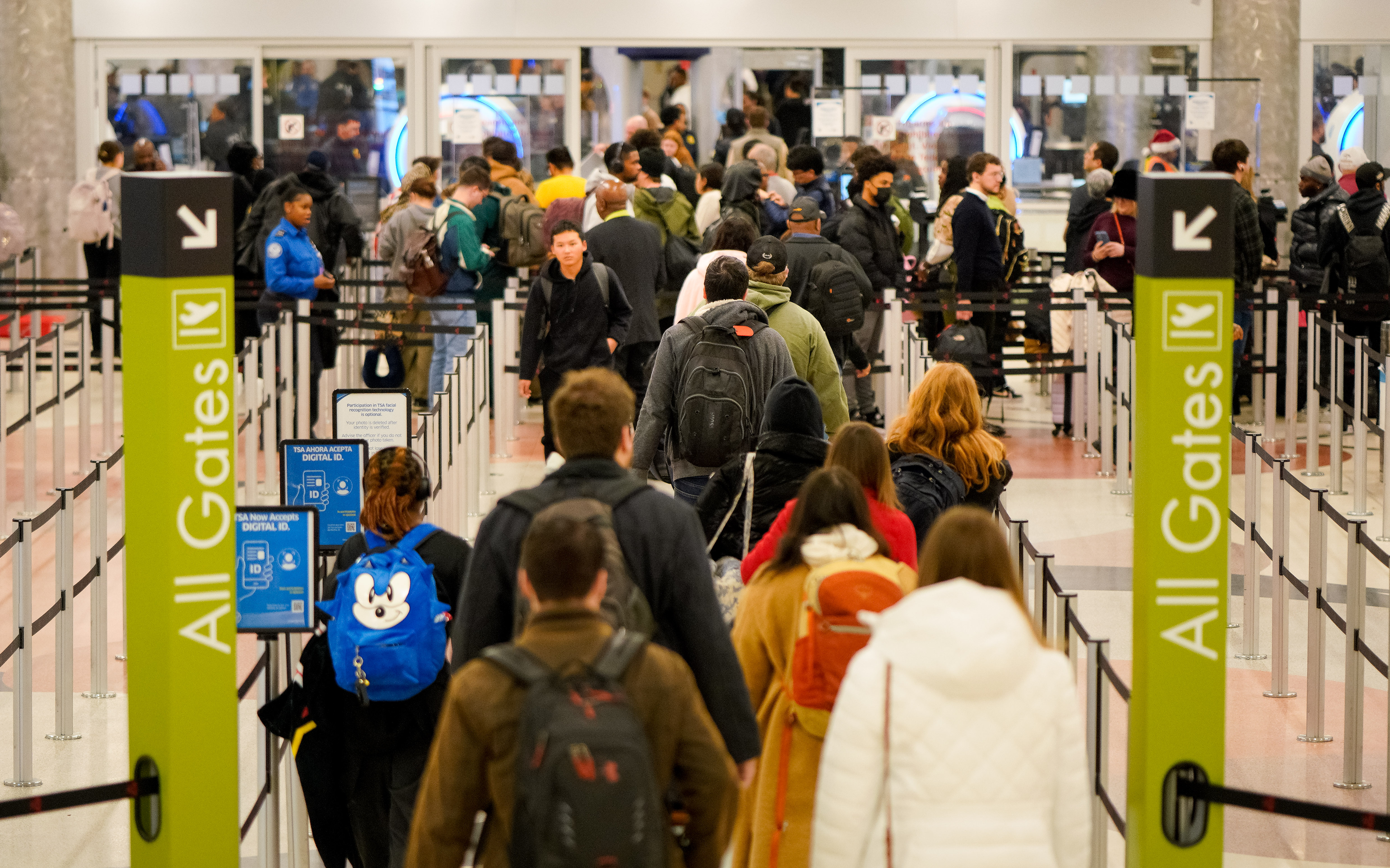 Travelers descend on Hartsfield-Jackson Atlanta International Airport in the final days of the holiday season. Friday, December 20, 2024 (Ben Hendren for the Atlanta Journal-Constitution)