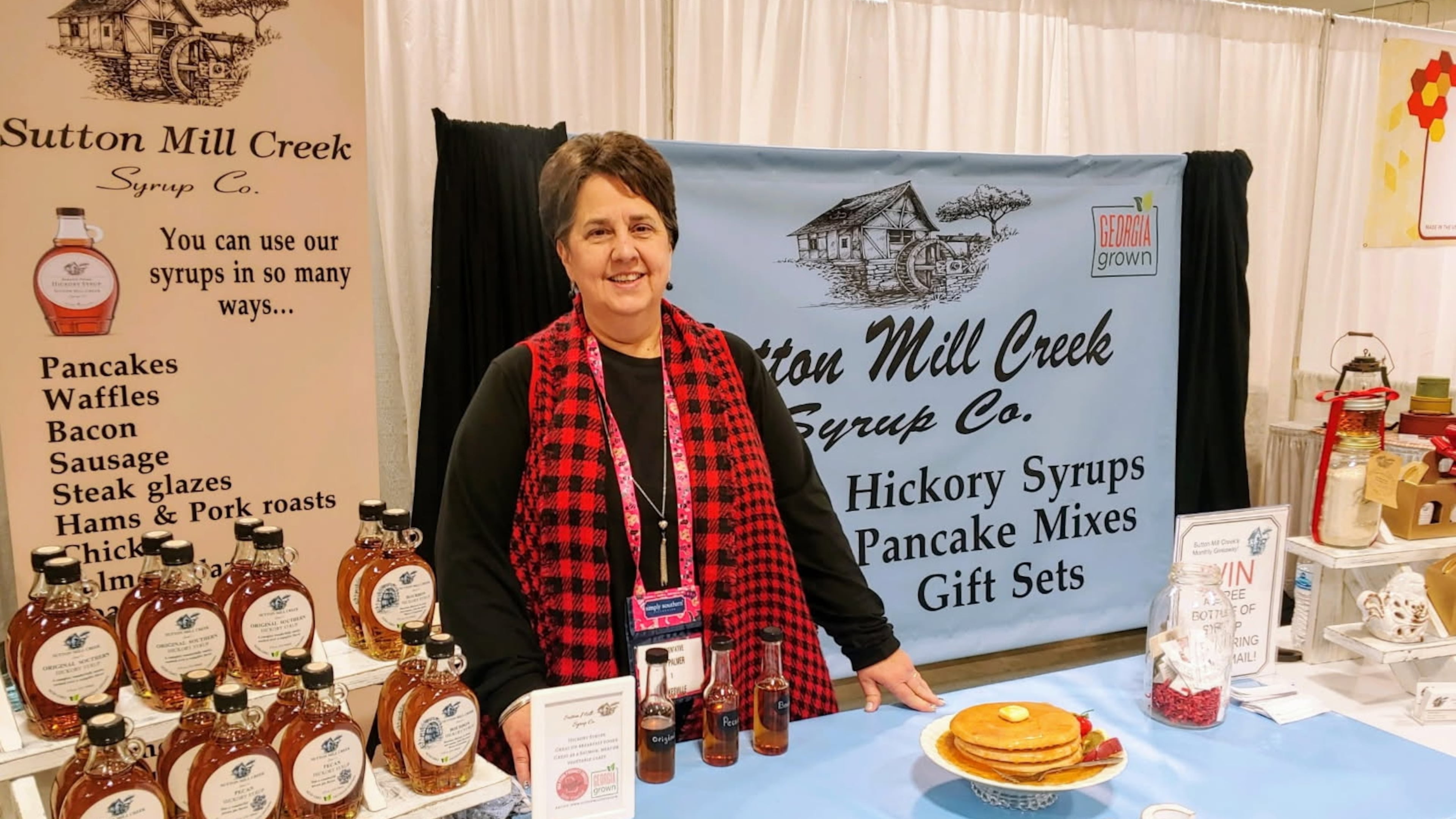 Beth Palmer, co-founder of Sutton Mill Creek Syrup, offers samples of her hickory syrup at festivals around the Southeast. (Courtesy of Sutton Mill Creek Syrup Co.)